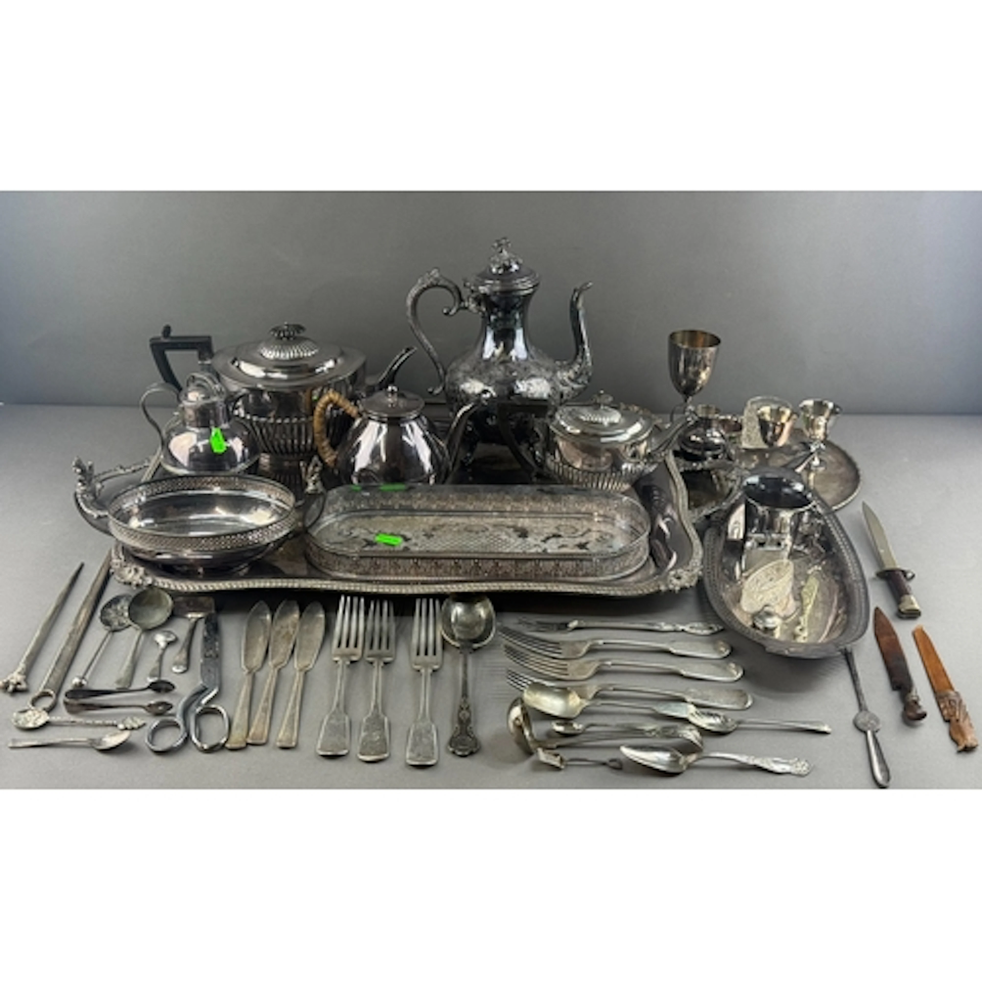 Silver Plate: an engraved two handled tray, 67cm max., a tea...