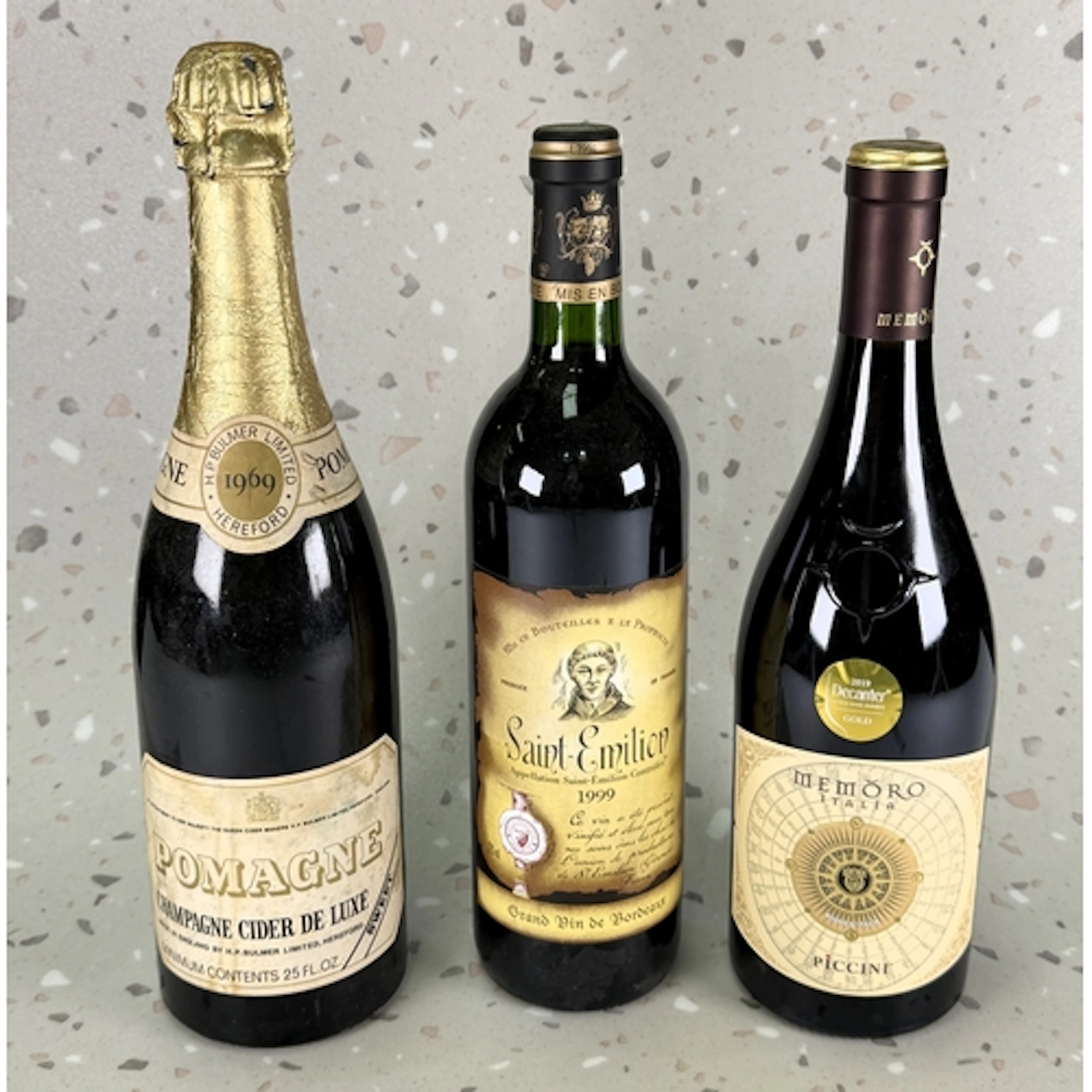 A bottle of saint-Emillion Grand Vin de Bordeaux 1999; a bot...