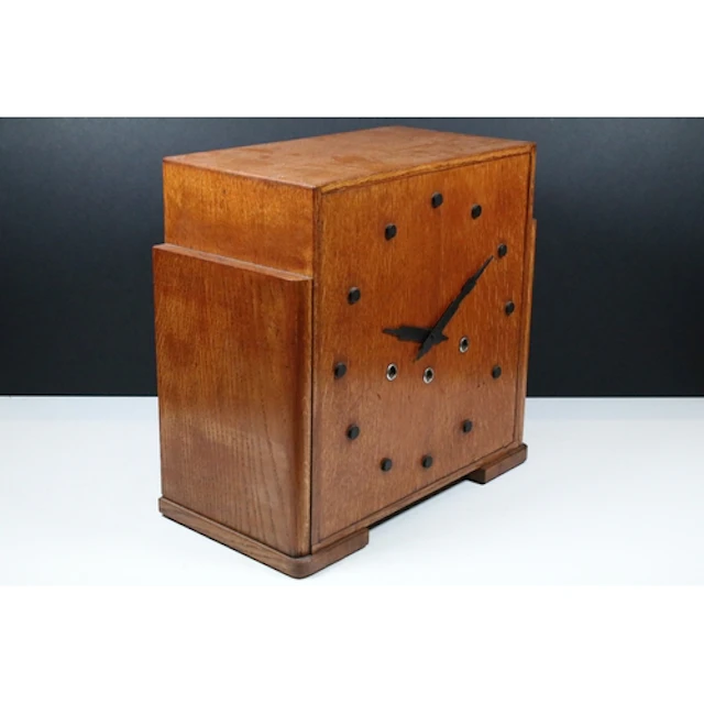Art Deco large oak mantle clock, the square case with steppe...