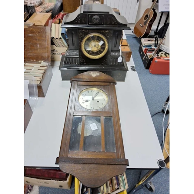 TWO CLOCKS OF DIFFERENT STYLES, the first is an impressive a...