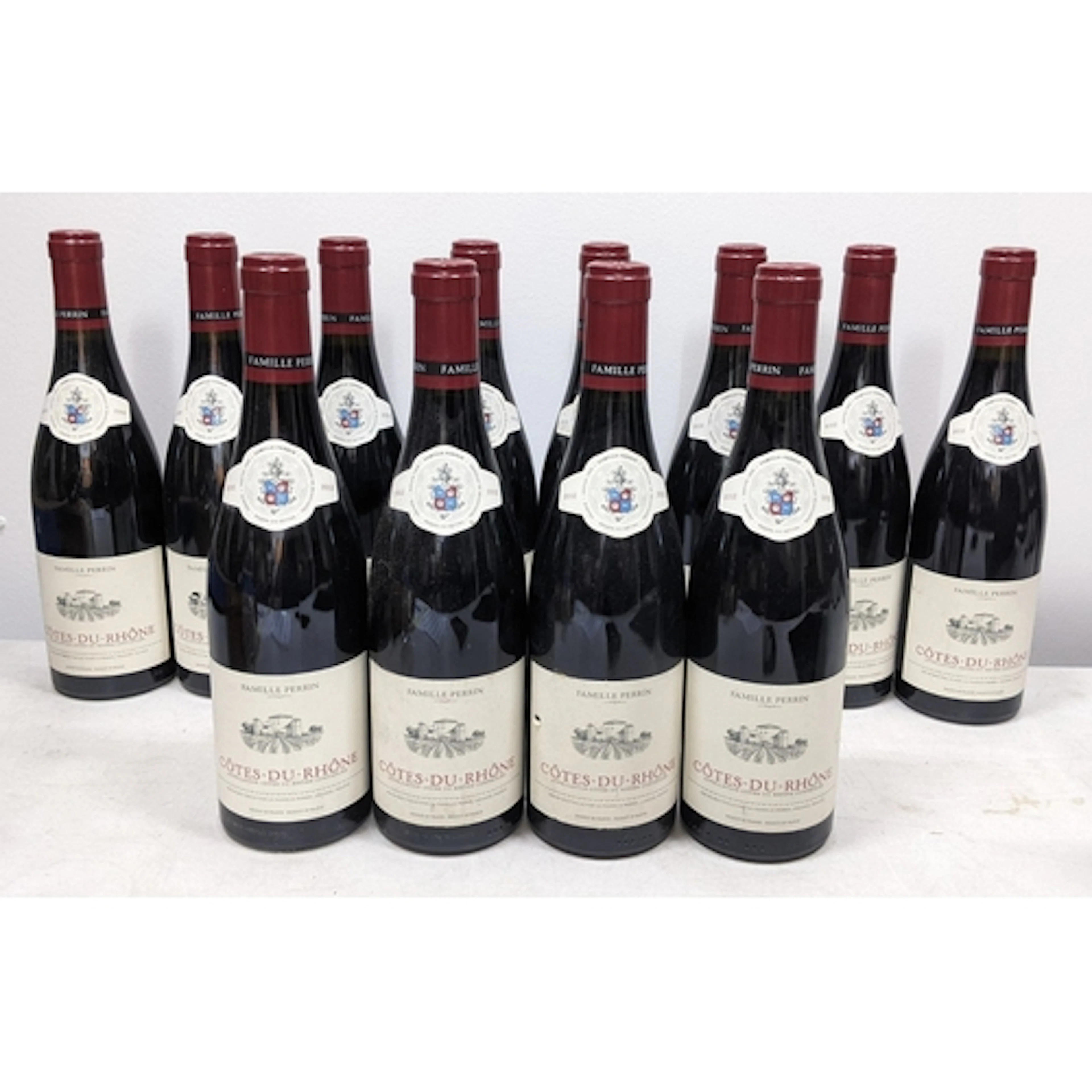 Twelve bottles of 2012 Famille Perrin Côtes-du-Rhône red win...