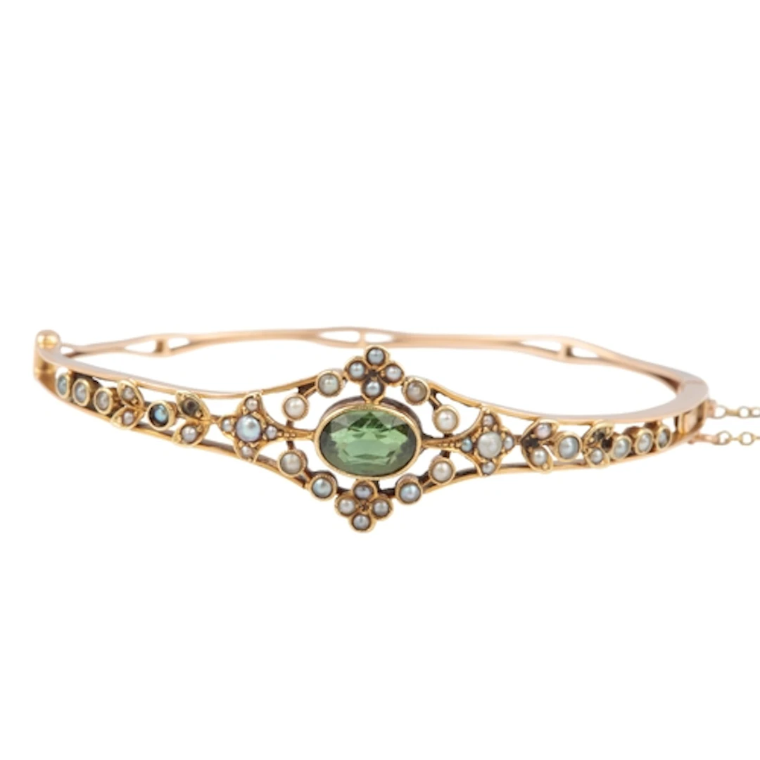 An Edwardian tourmaline and seed pearl bangle, early 20th ce...