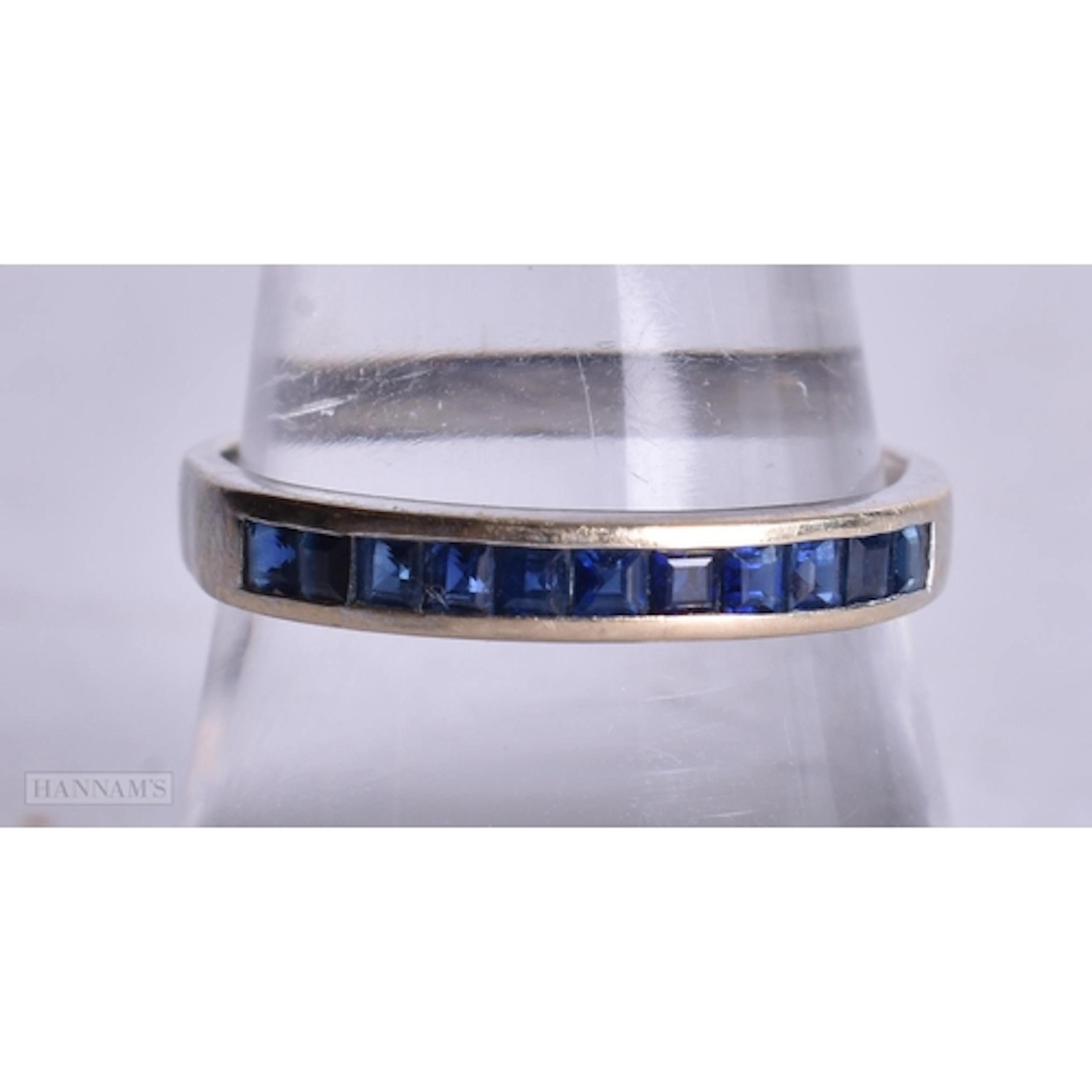 18ct white gold sapphire half eternity ring (2.2g). R.