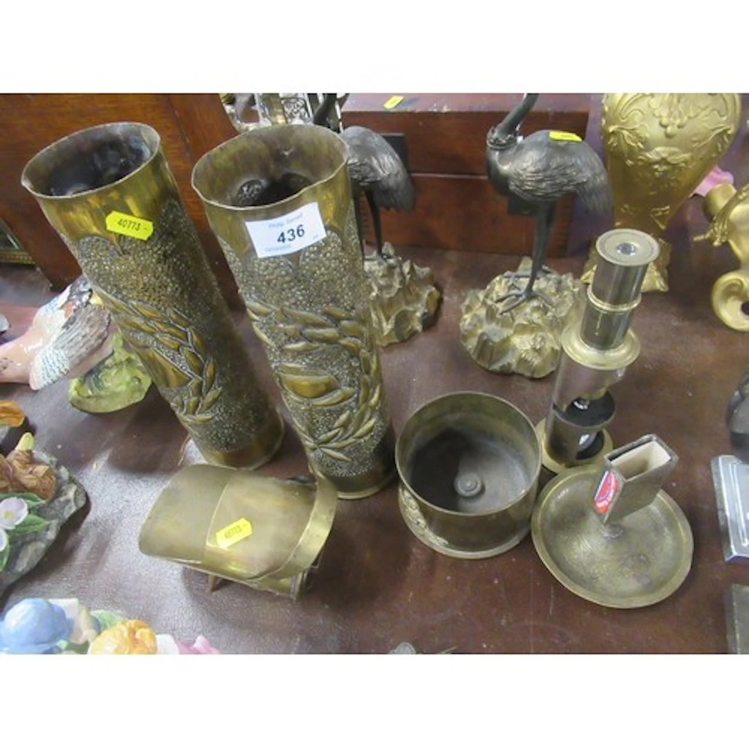 A collection of brass trench art