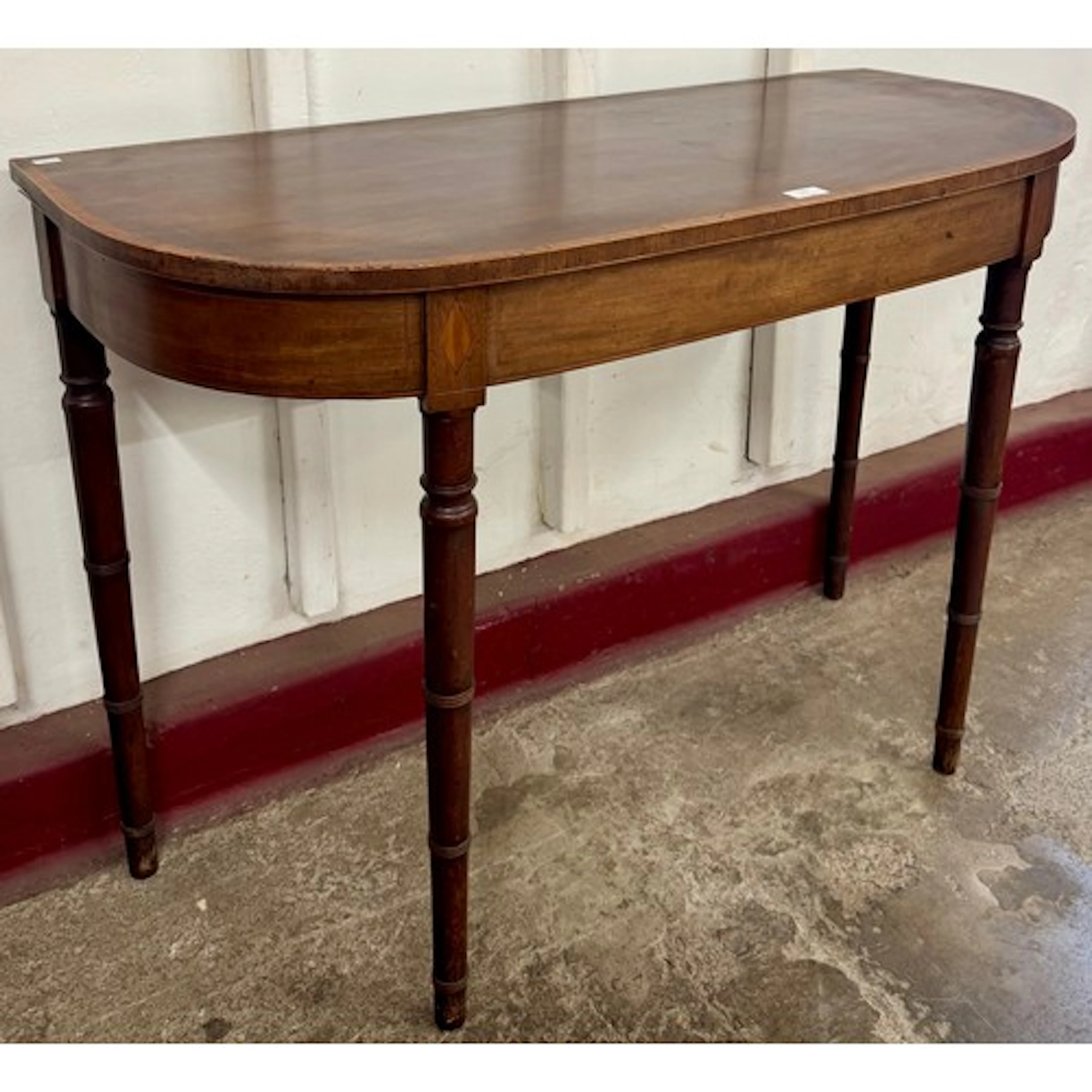 A George IV inlaid mahogany demi-lune console table