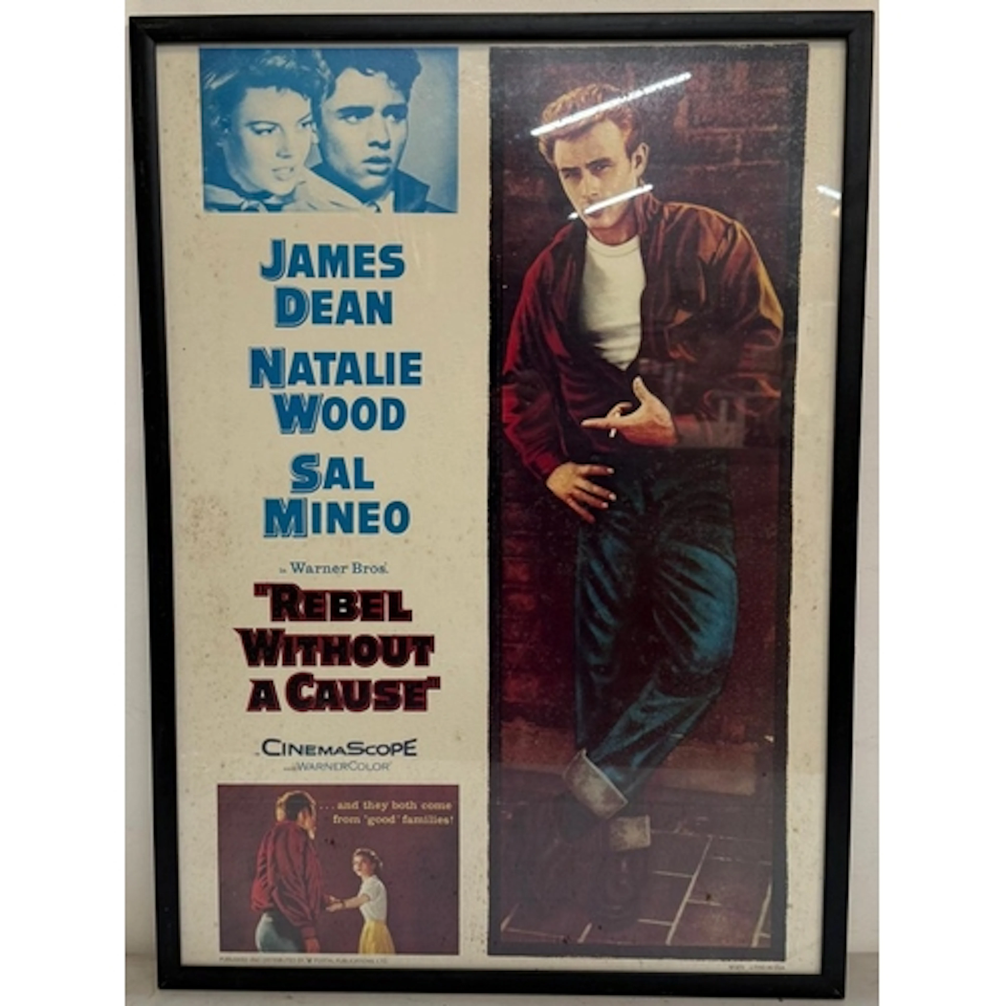 A vintage framed film poster for Rebel Without a Cause starr...