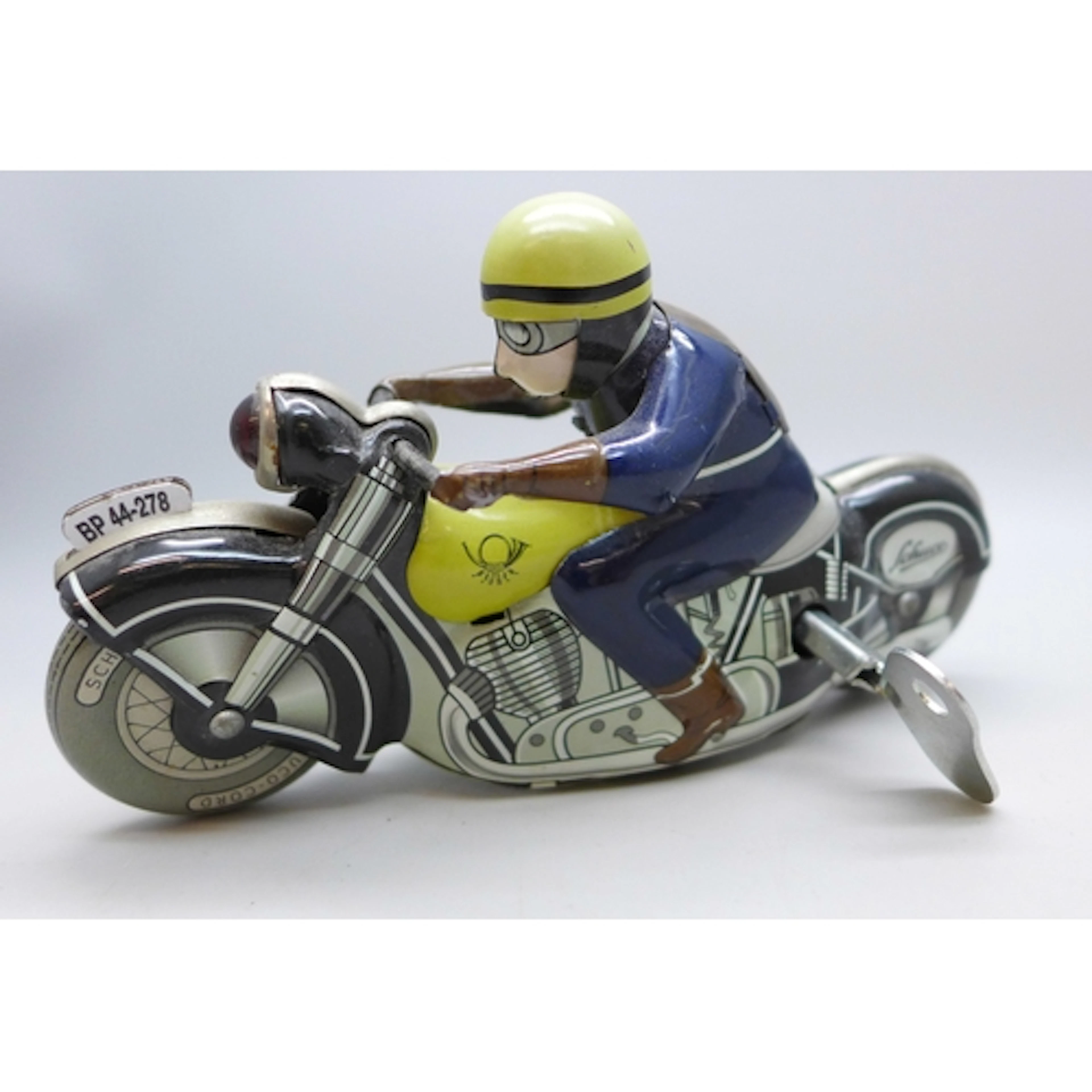 A Schuco 1006 Moto-Racer tin-plate clockwork toy with key, (...