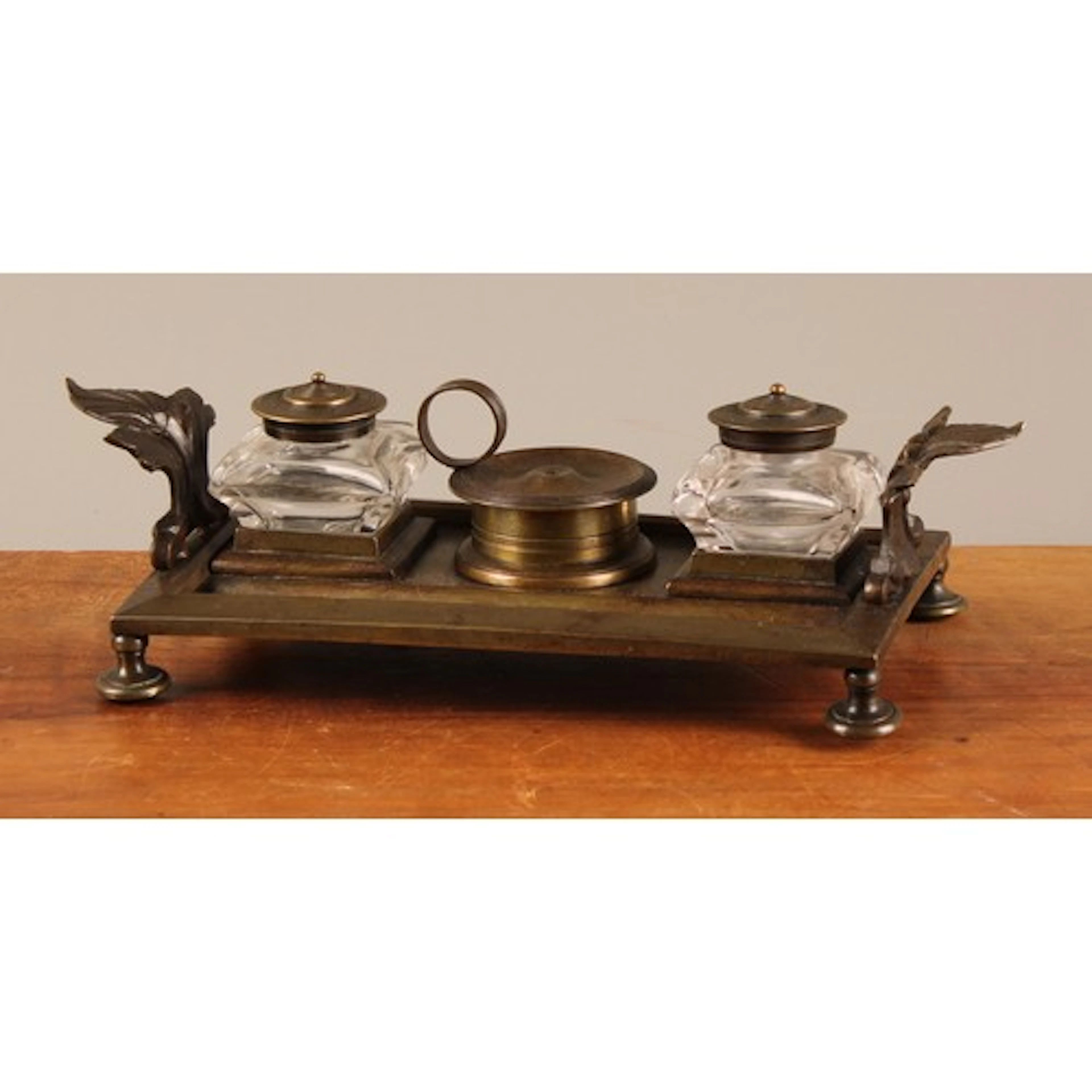 A post-Regency bronze rectangular inkstand, central wafer bo...