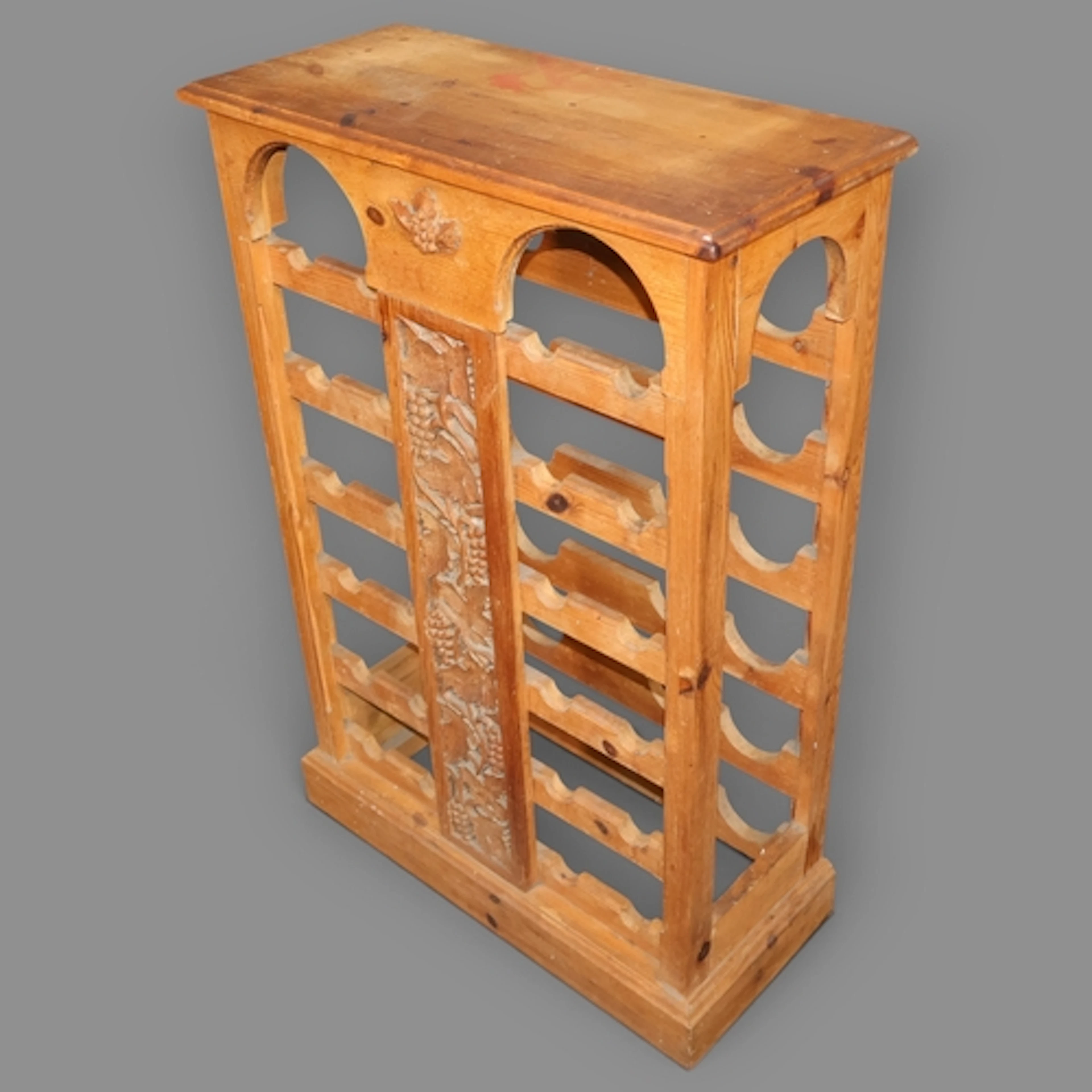 A vintage pine bottle rack, constructed from reclaimed timbe...