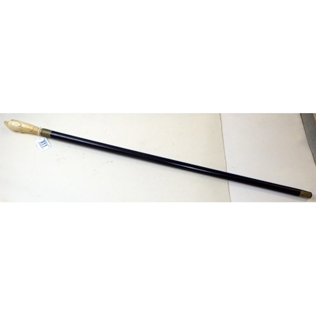 A bone handled walking stick with handle in the form of a do...