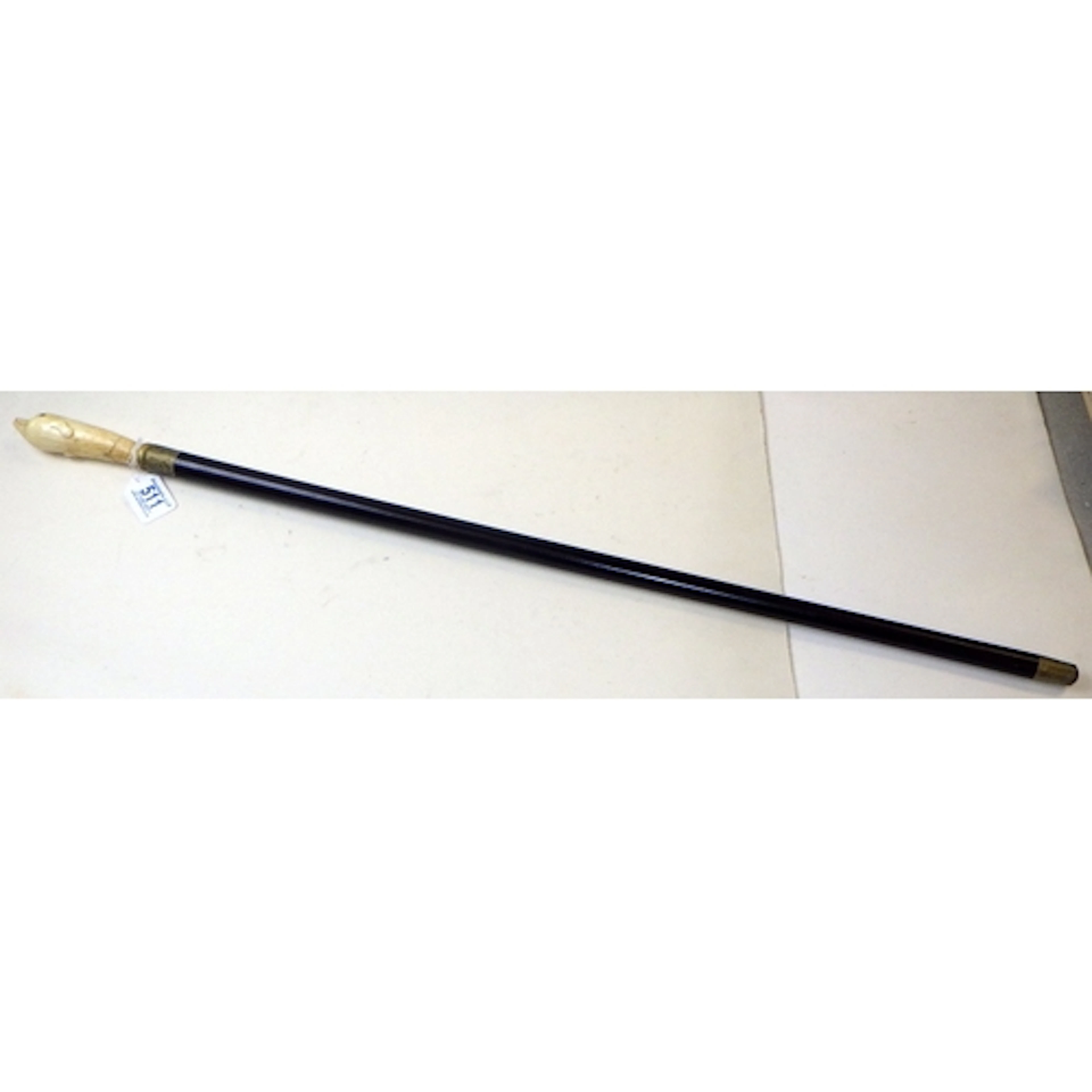 A bone handled walking stick with handle in the form of a do...