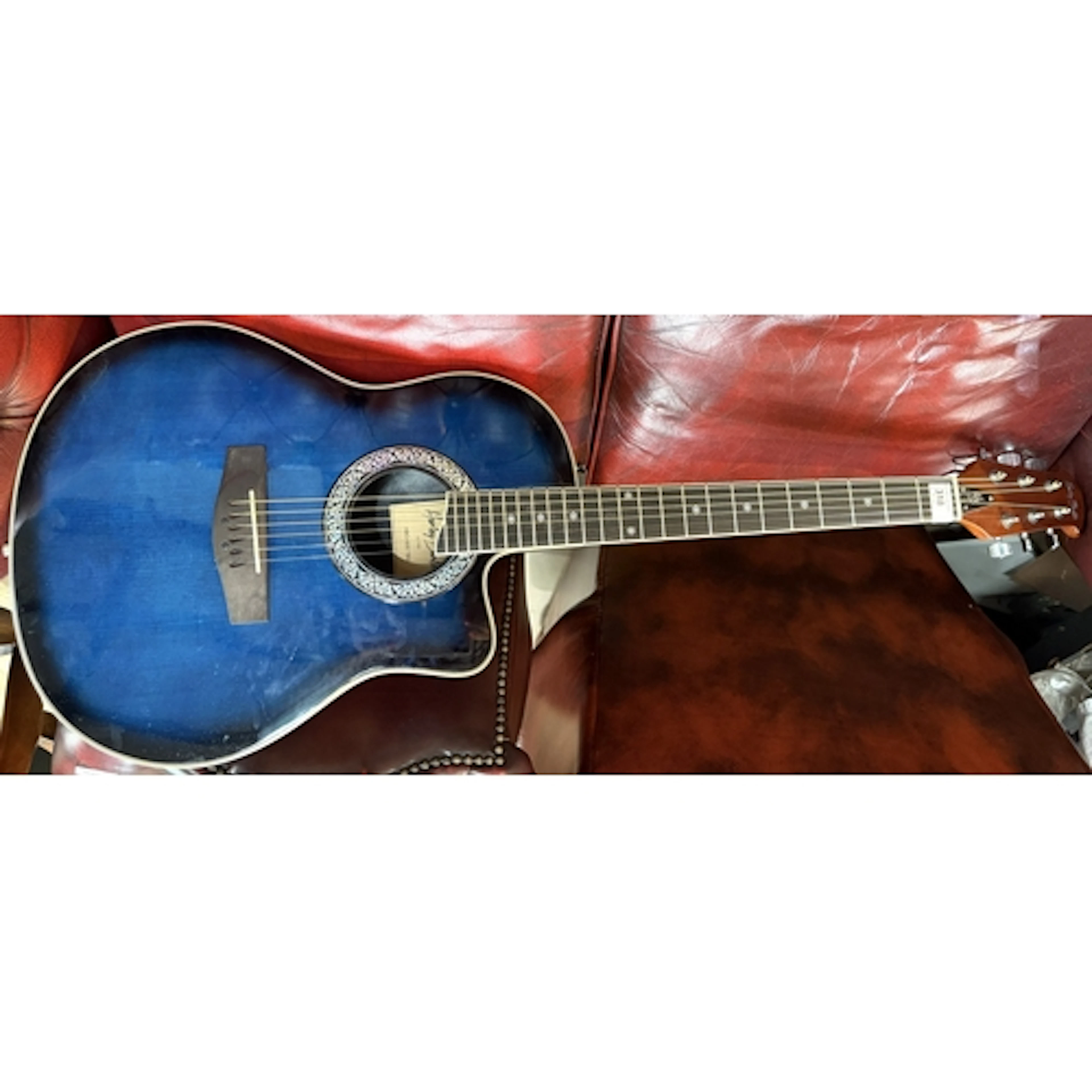 A Harley Benton blue burst acoustic round back guitar with e...
