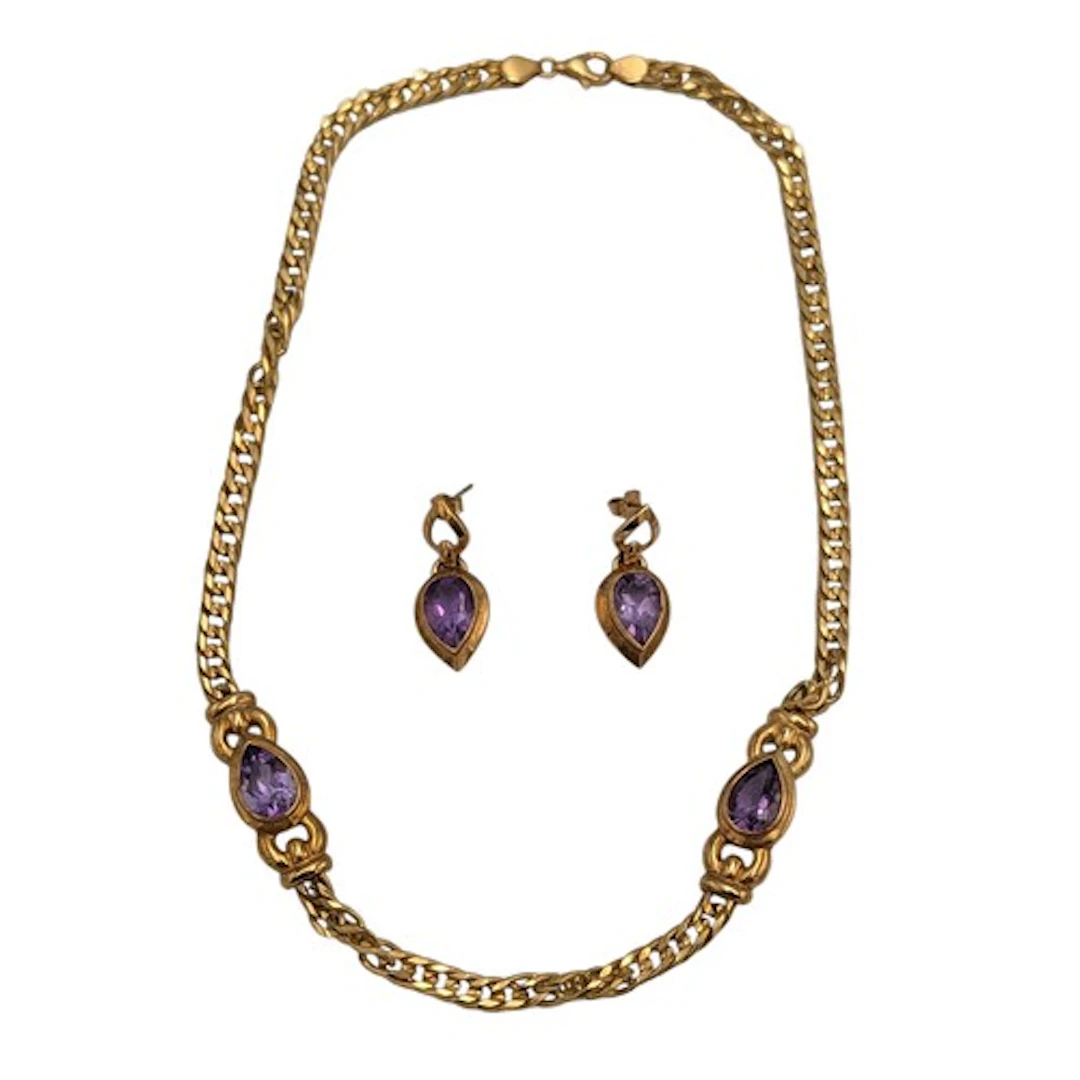 A 9ct gold and amethyst jewellery suite including a curb lin...