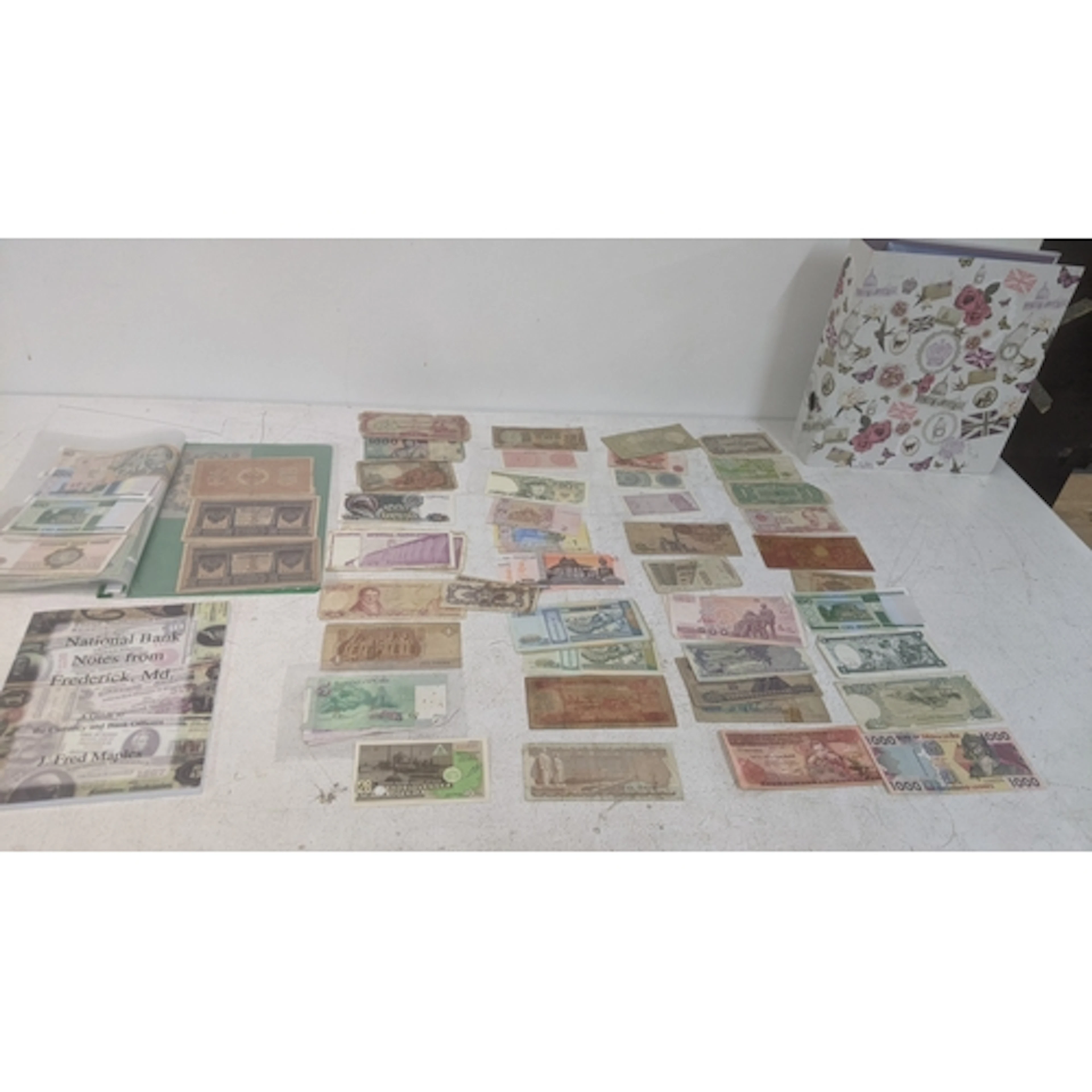 A large collection of bank notes from around the world to in...