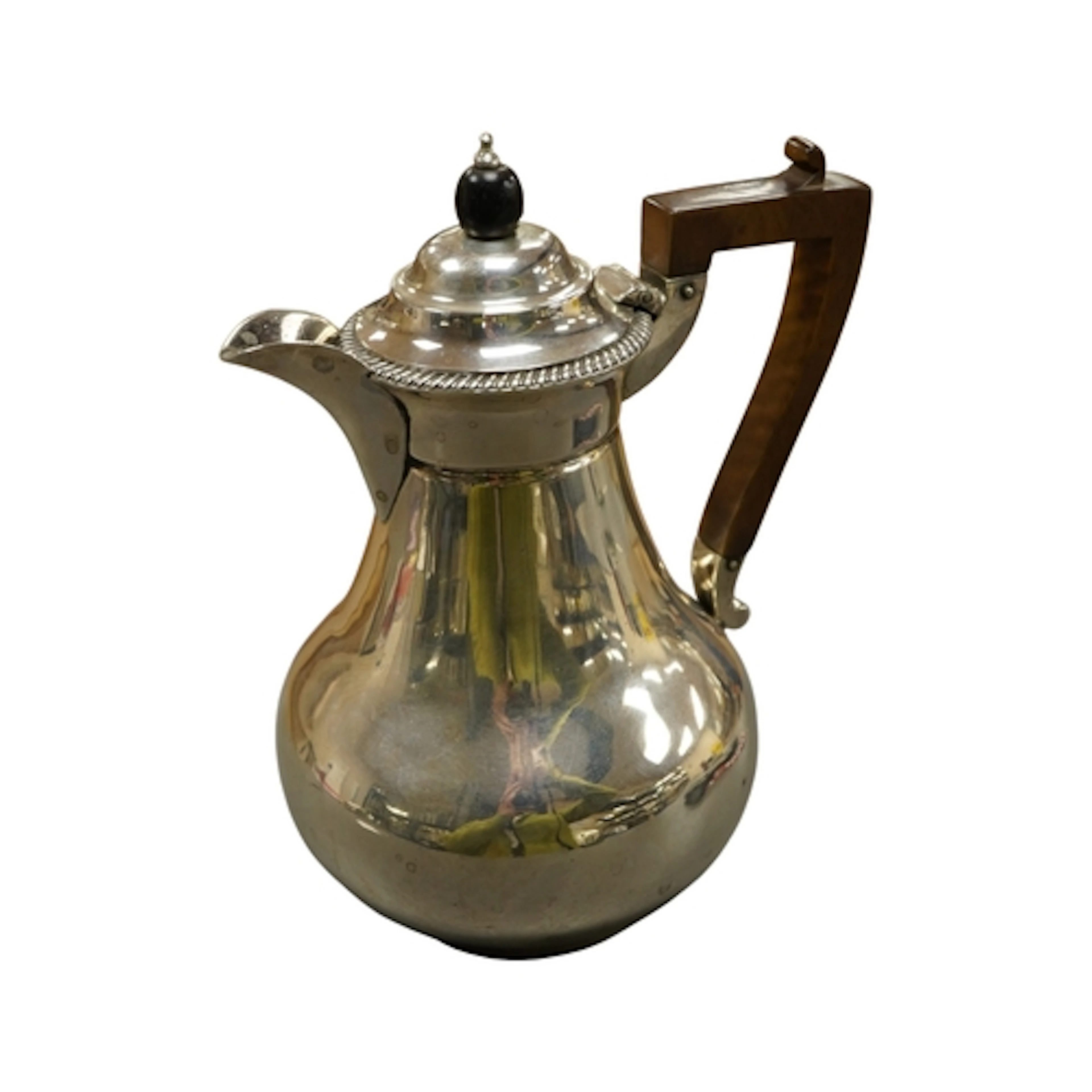 A late Victorian silver hot water pot by John Aldwinckle & T...
