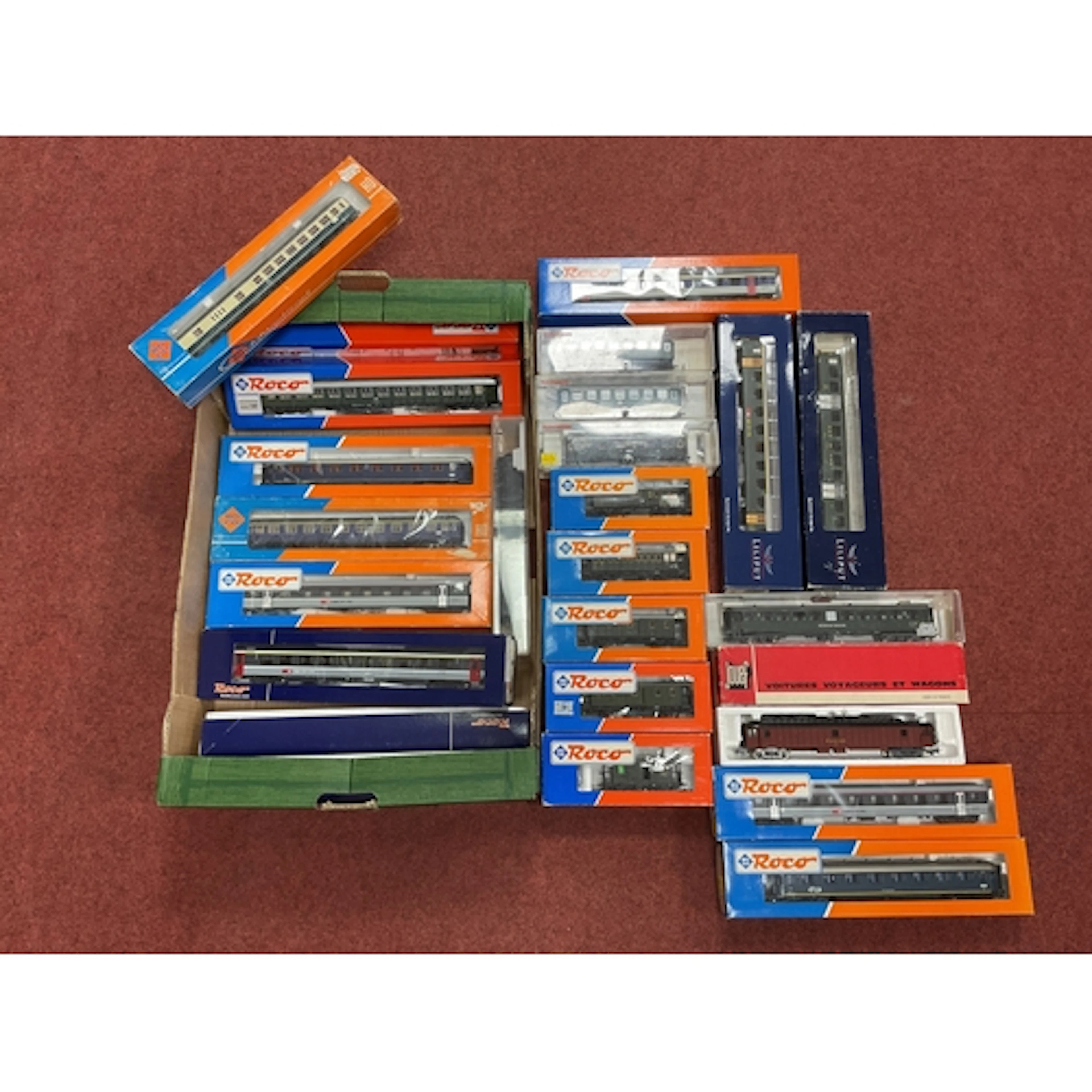 Approximately twenty-four boxed HO scale European coaches an...