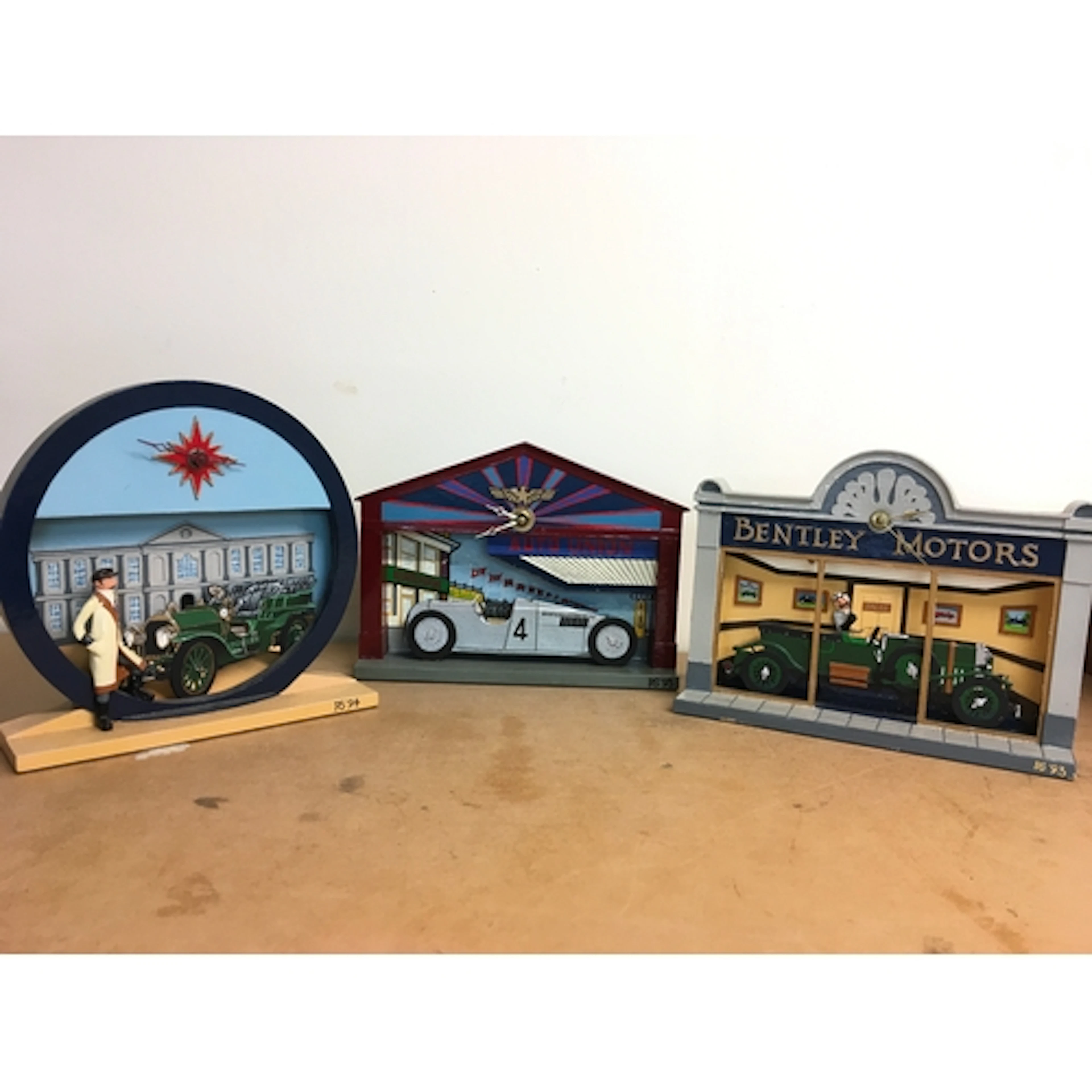Three hand crafted and painted battery operated classic car ...