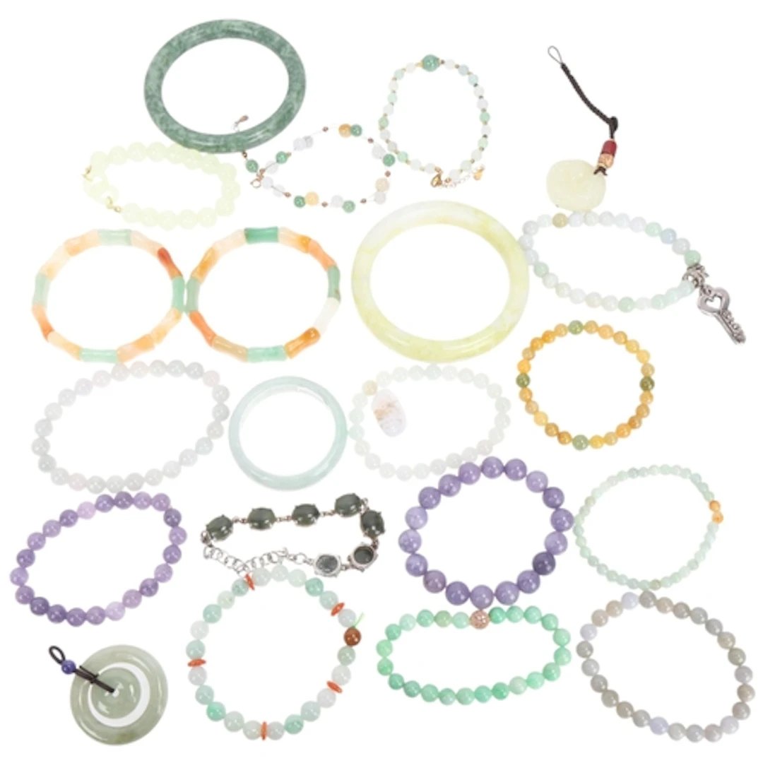 A quantity of jade bangles and bracelets, including Gemporia...
