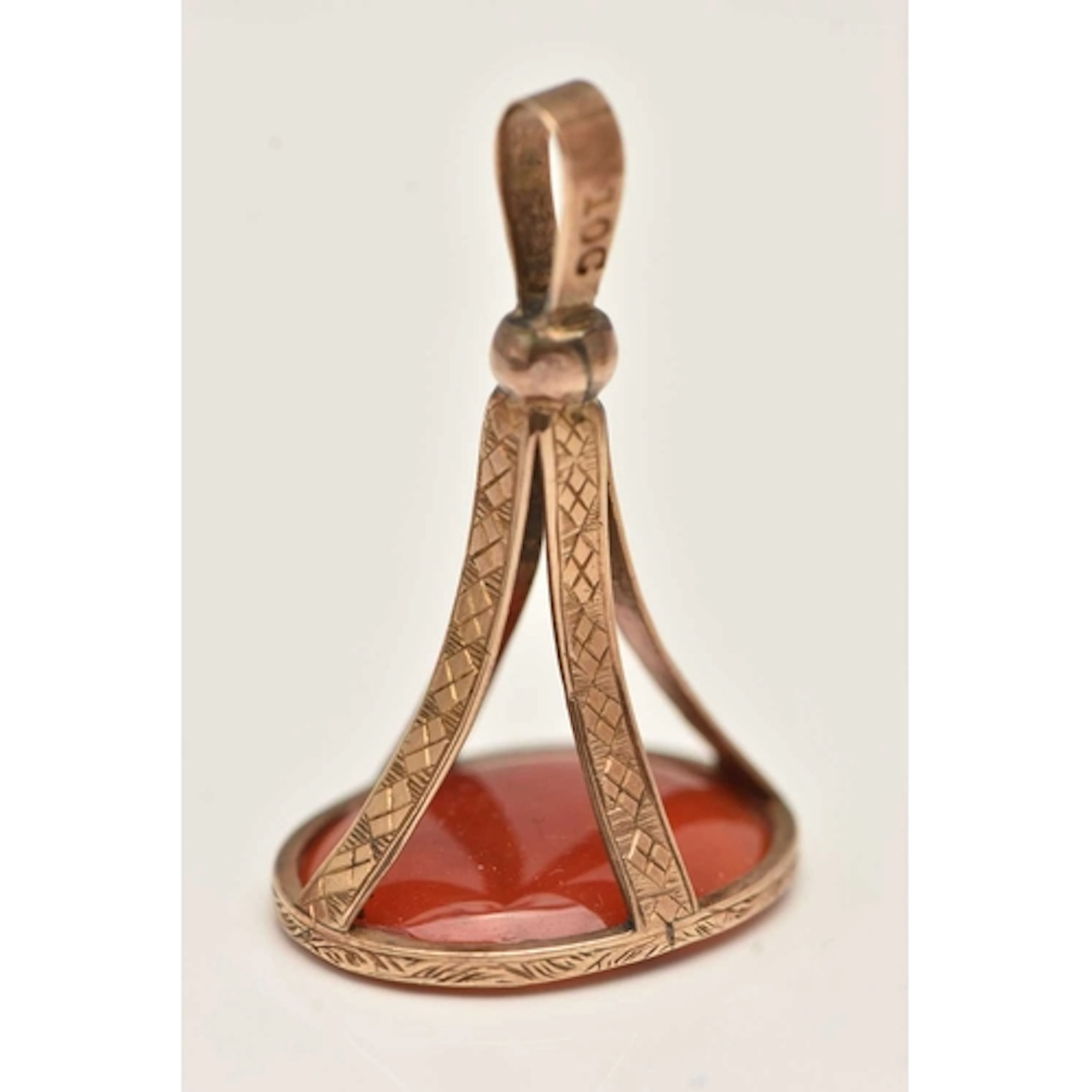 A YELLOW METAL CARNELIAN INTAGLIO FOB SEAL, of an oval form,...