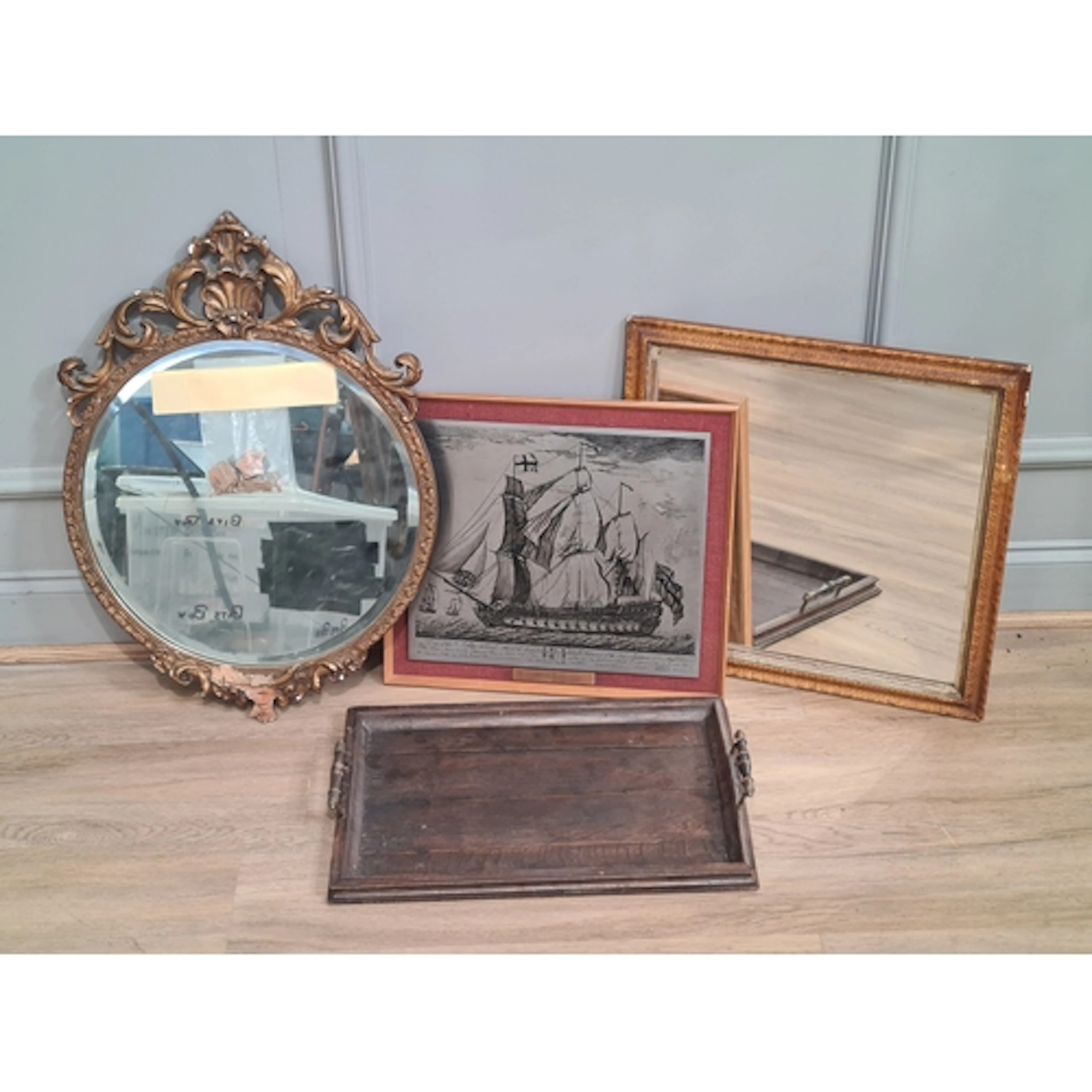 A gilt circular Wall Mirror with shell and leafage designs a...