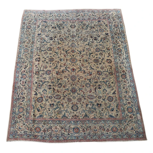 ORIENTAL CARPET OF KASHAN DESIGN. The ivory field with an al...