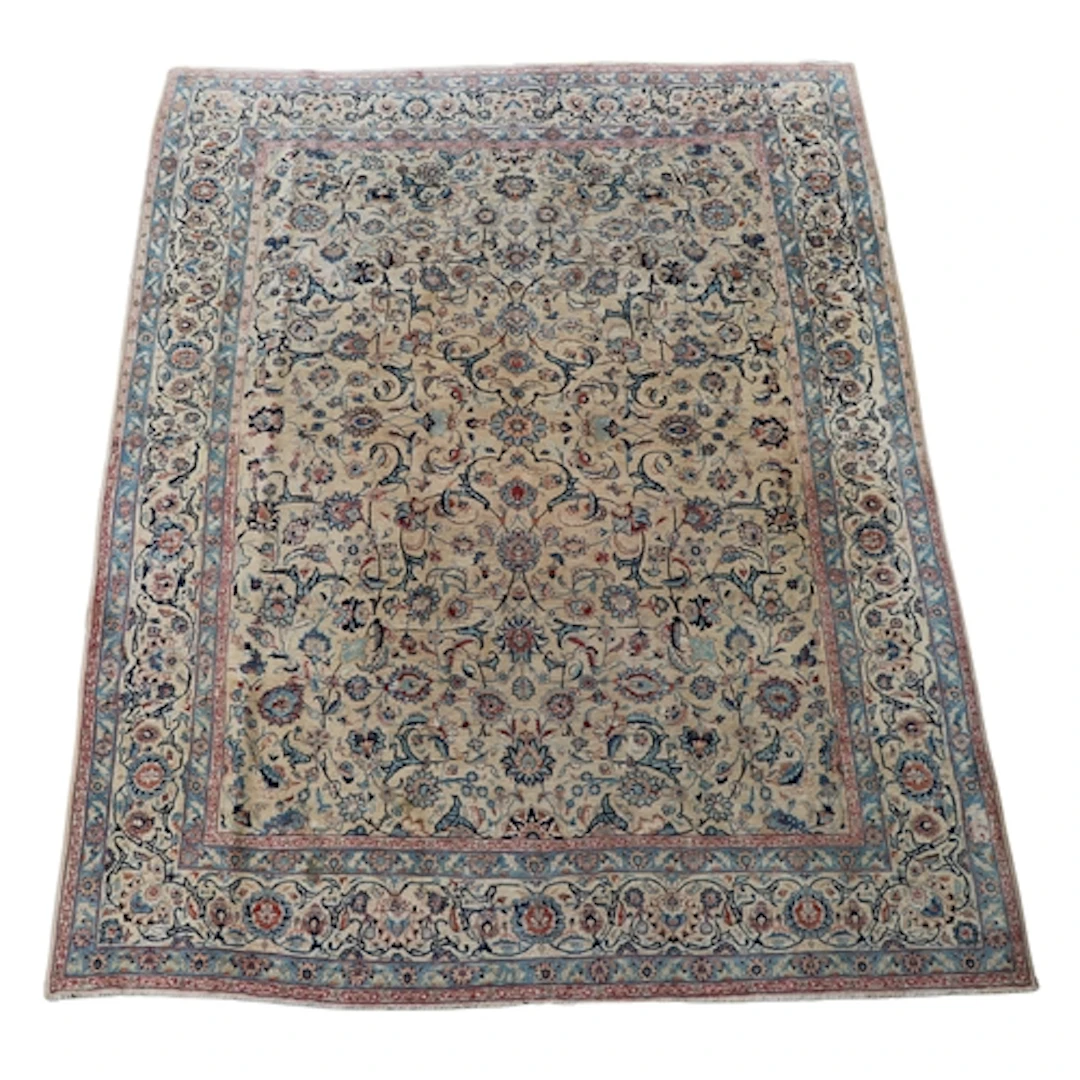 ORIENTAL CARPET OF KASHAN DESIGN. The ivory field with an al...