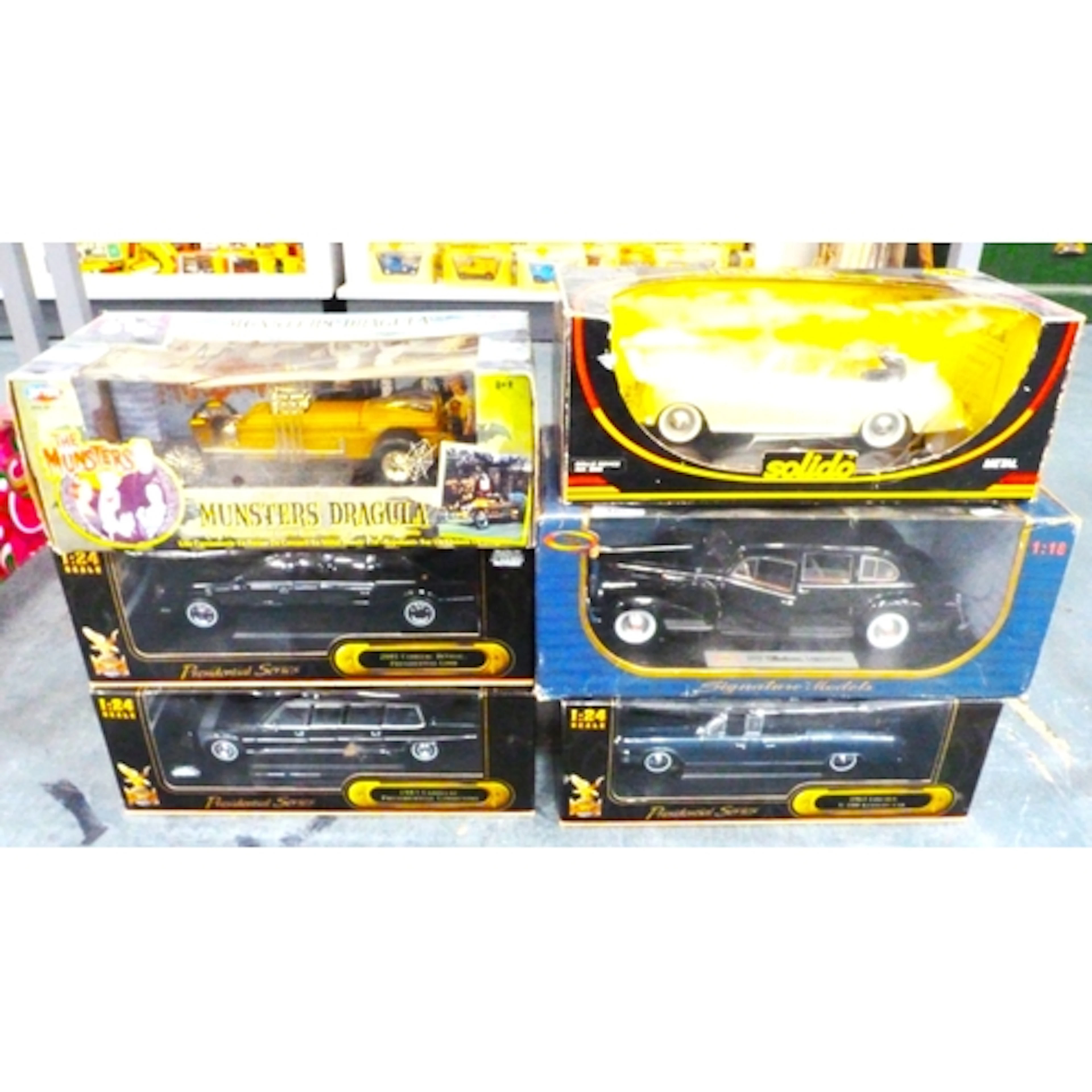 Four boxed Presidential series scale model cars to include 1...