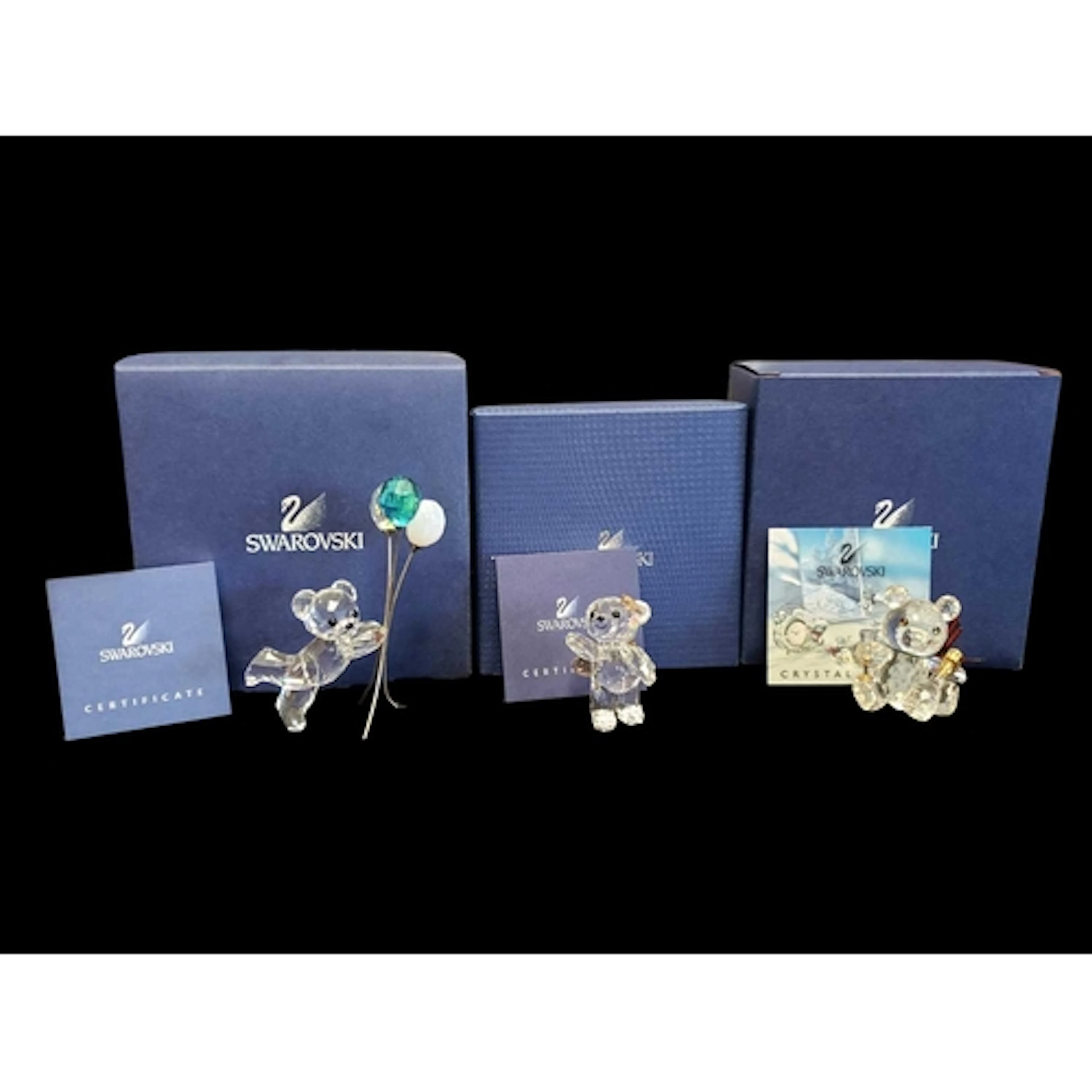 Swarovski - Three boxed 21st century crystal glass Kris Bear...
