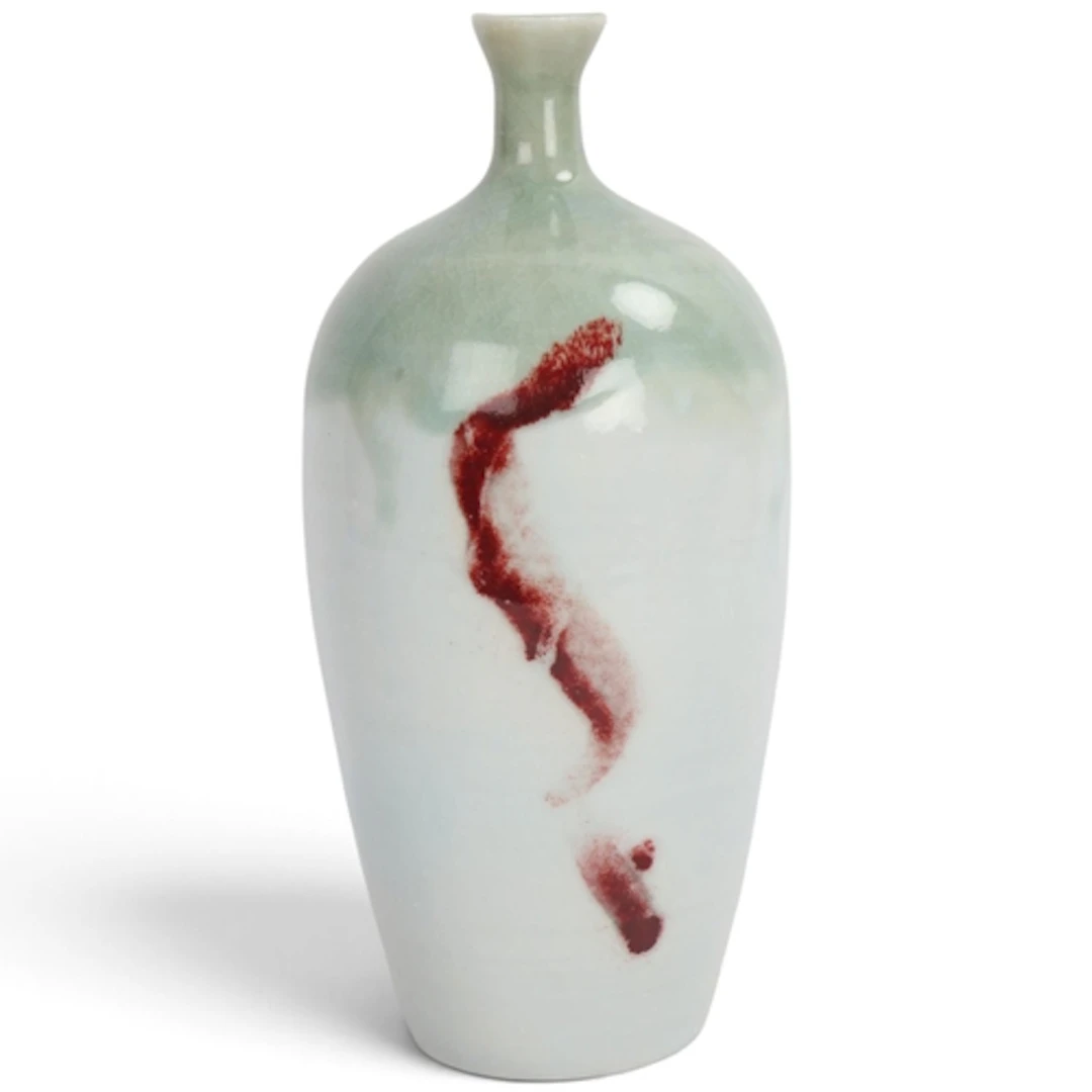 A studio pottery porcelain vase with celadon crackle glaze a...
