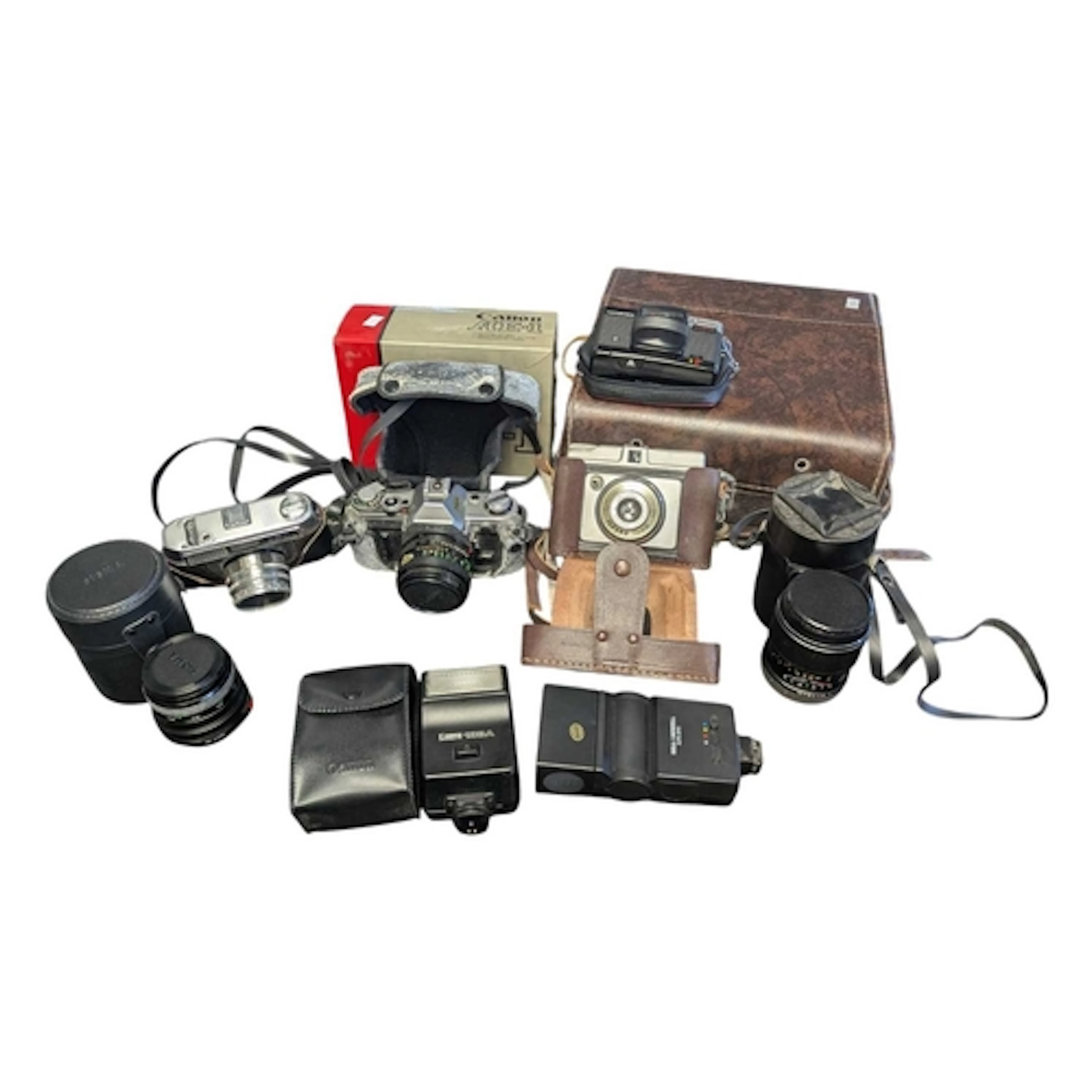Collection of late 20th century vintage cameras and lenses. ...