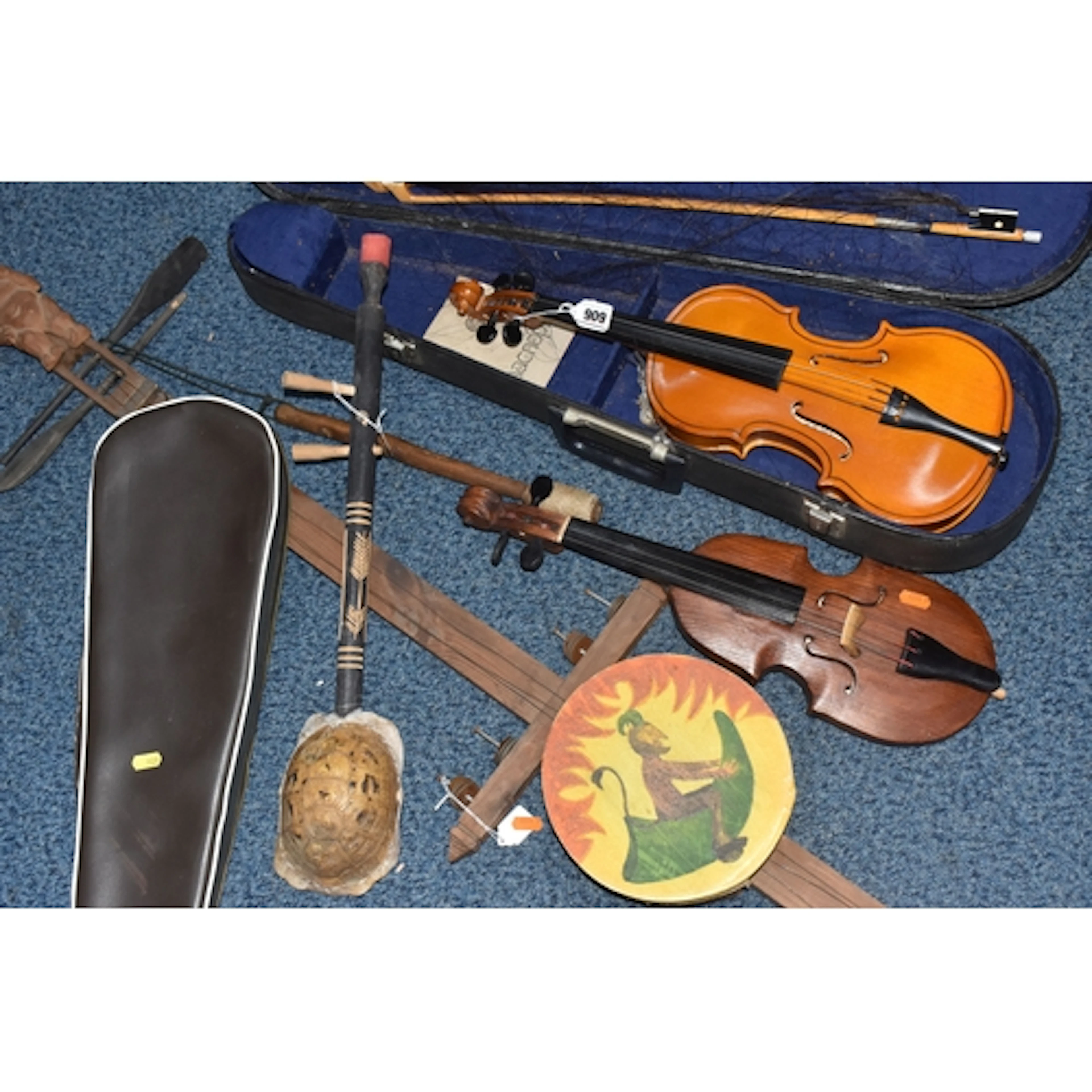 A GROUP OF INTERNATIONAL STRINGED INSTRUMENTS comprising a P...