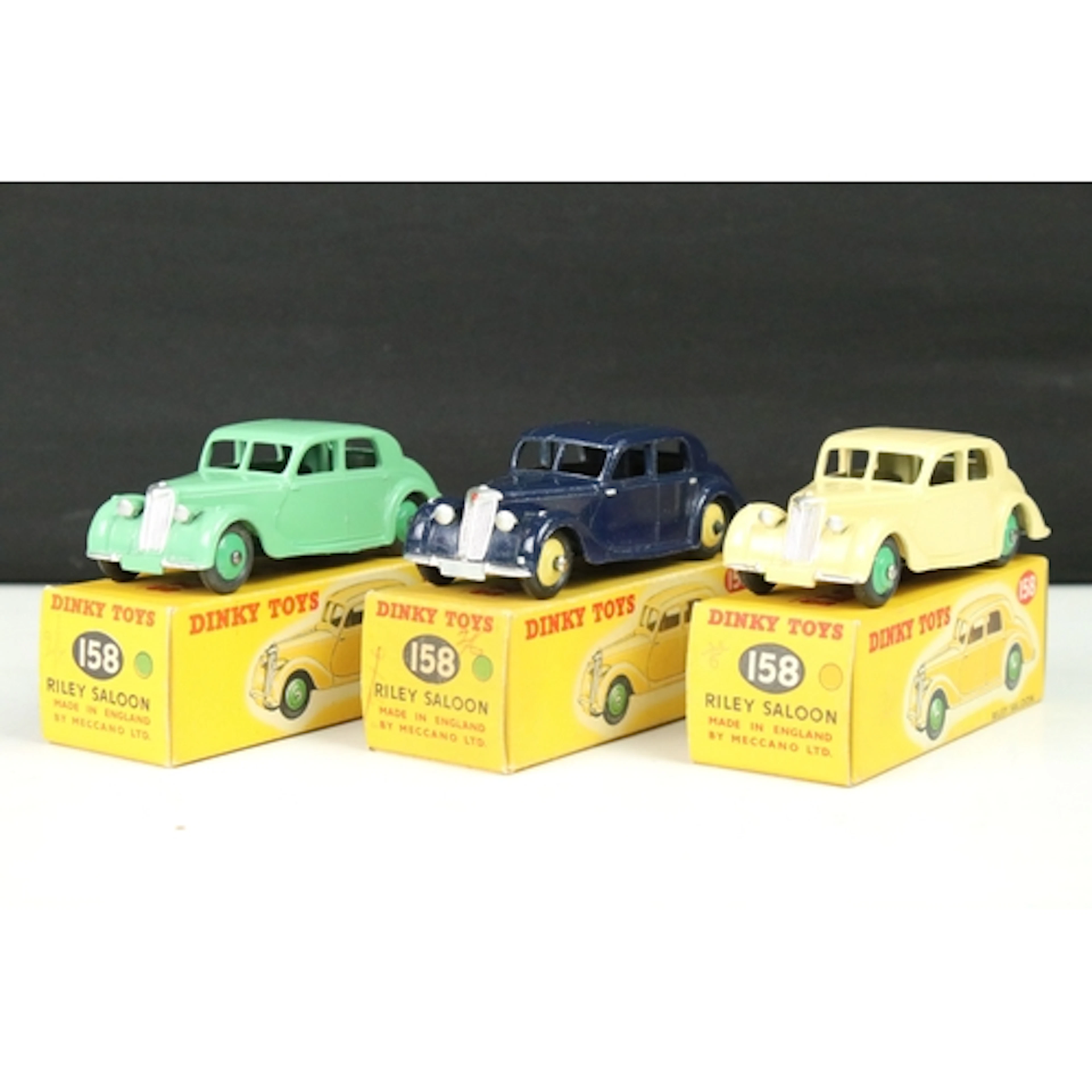 Three boxed Dinky 158 Riley Saloon diecast models to include...