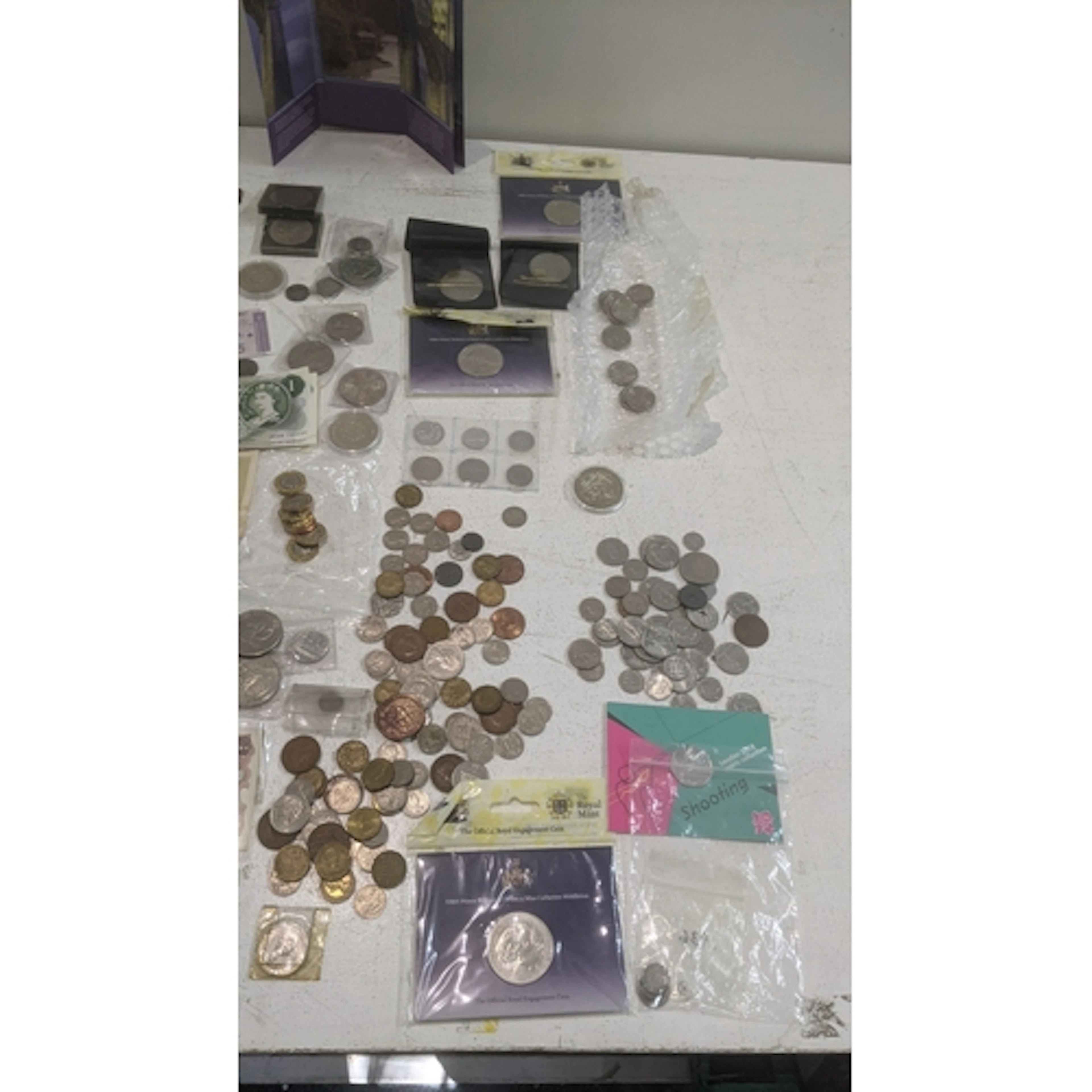 A large collection of coins to include a folder of commemora...