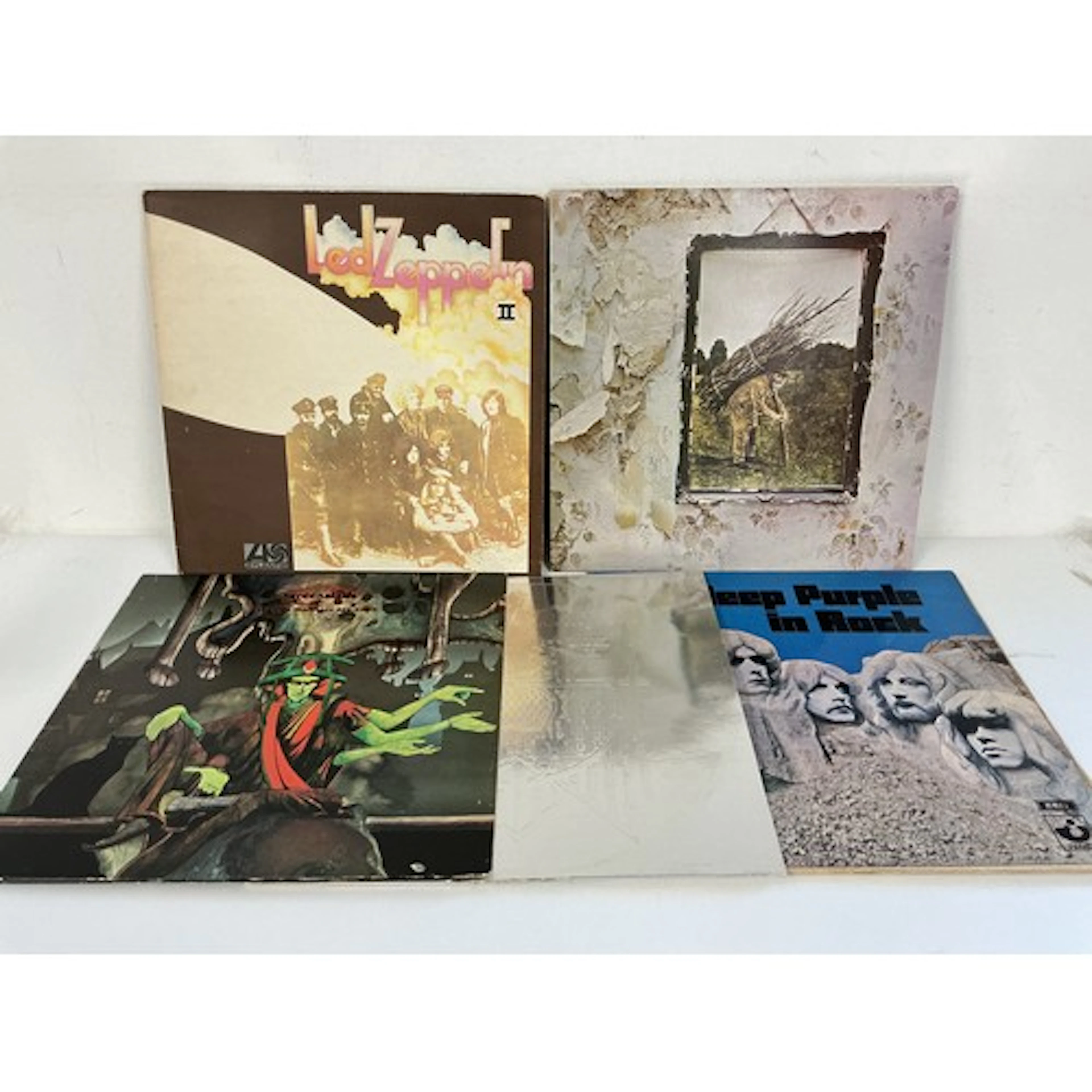 Four rock LPs and a 12” single comprising Led Zeppelin II wi...