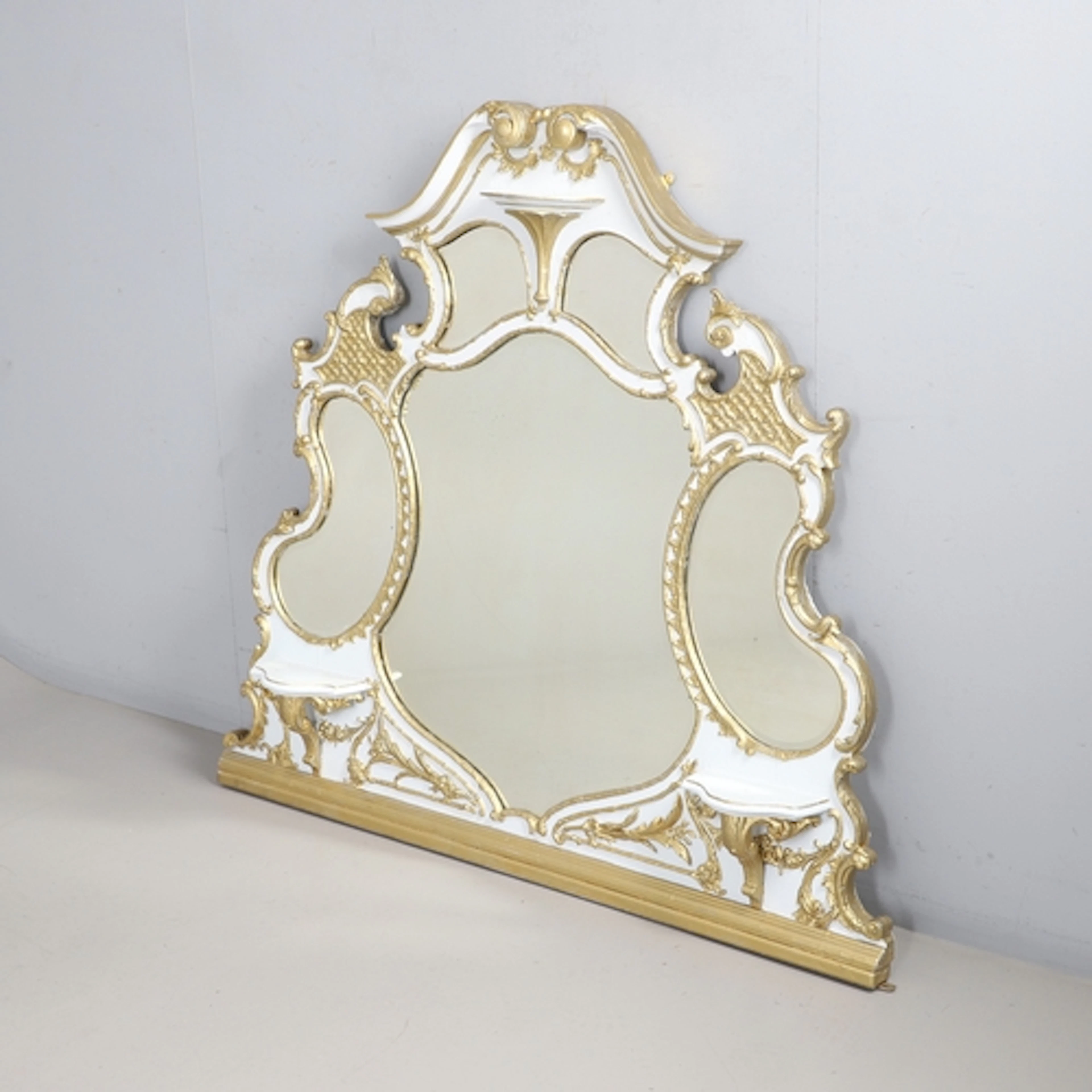A FRENCH PAINTED AND GILDED OVERMANTEL MIRROR. late 19th cen...