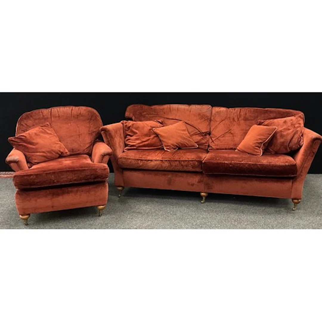 A late 20th century burnt orange Duresta sofa suite comprisi...