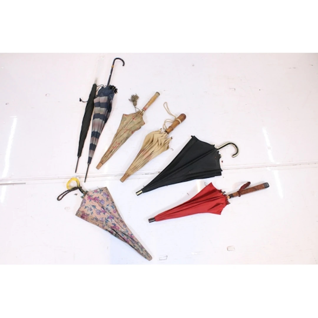 Group of seven umbrellas, to comprise one with perspex or lu...