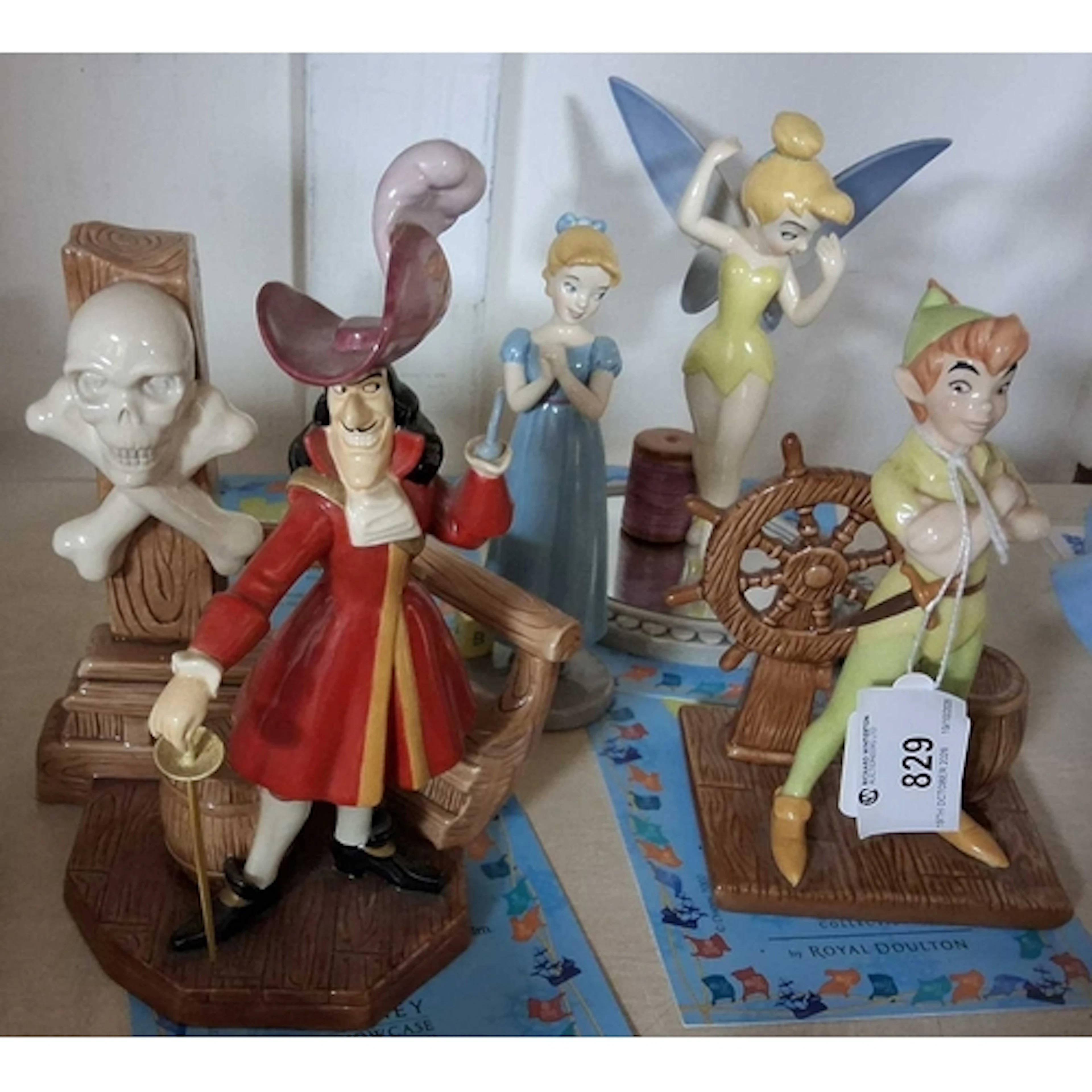 FOUR ROYAL DOULTON FIGURES FROM WALT DISNEY'S PETER PAN, the...