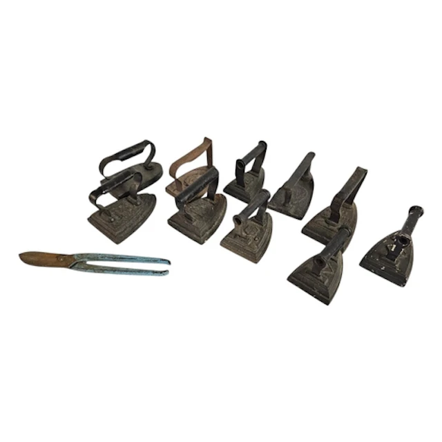 A COLLECTION OF TEN VICTORIAN HEATING IRONS Black painted fi...