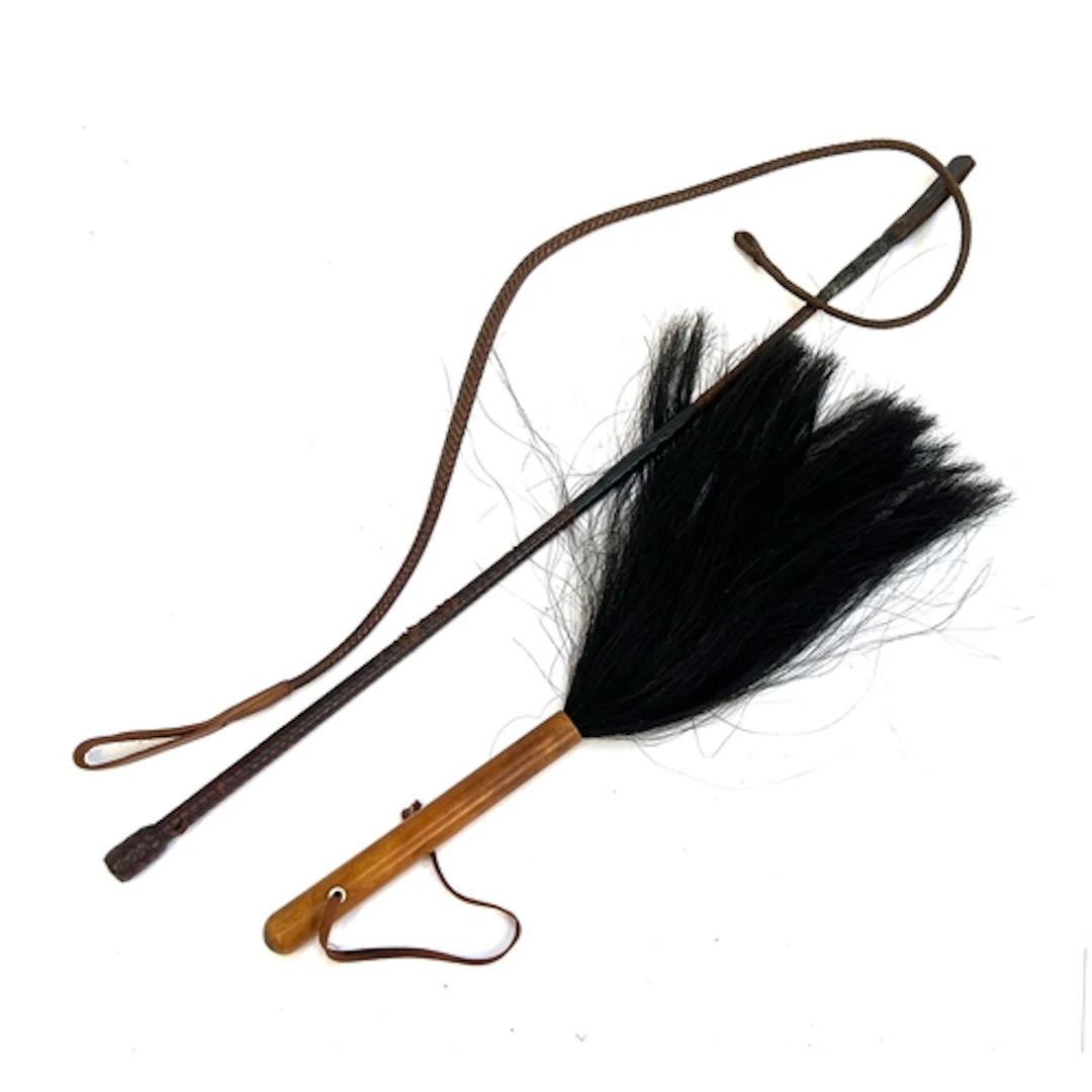 A horse hair fly swat, together with a riding whip and a spa...