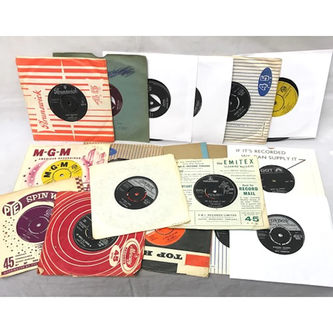 A collection of 18 vinyl 7" single records incl early rock a...