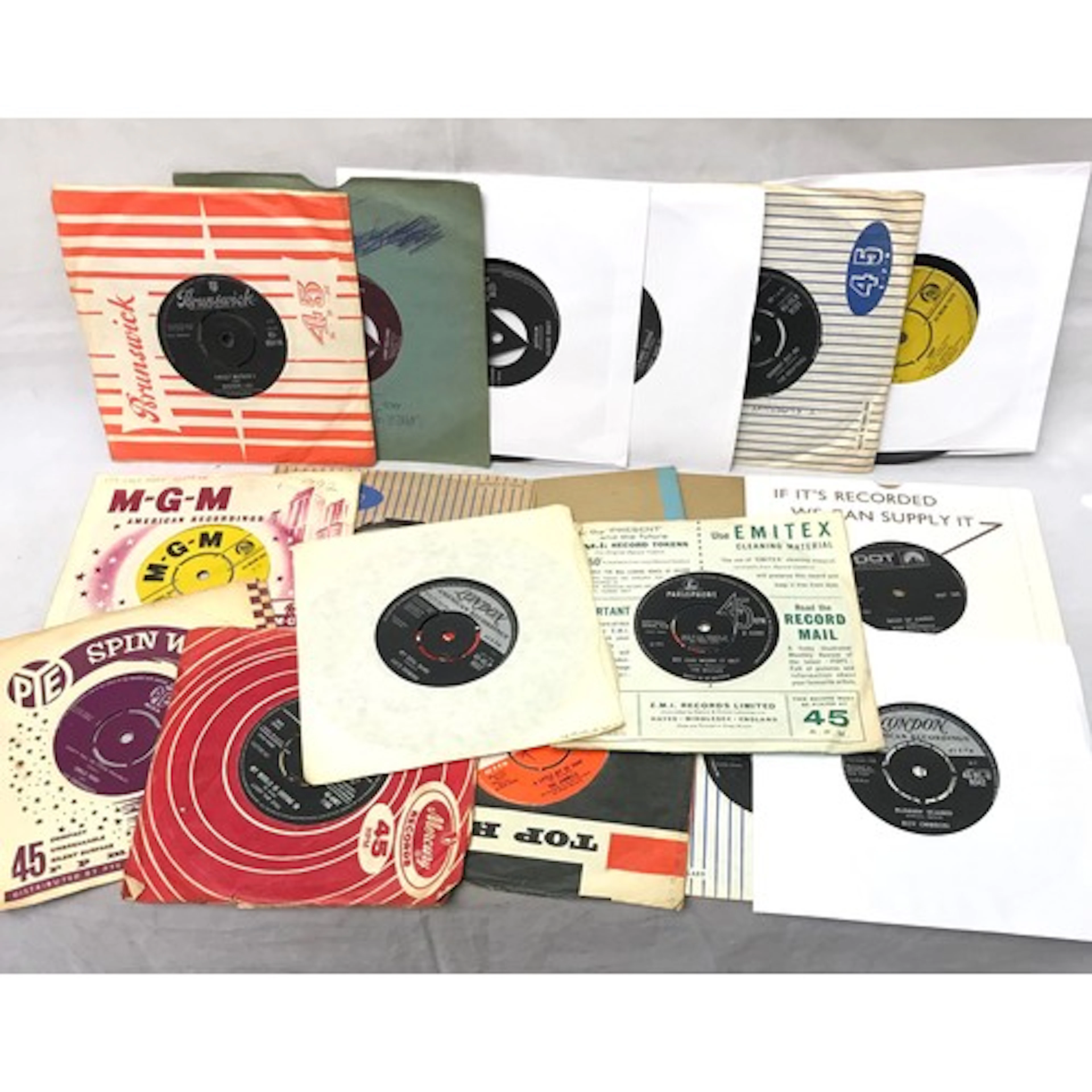 A collection of 18 vinyl 7" single records incl early rock a...