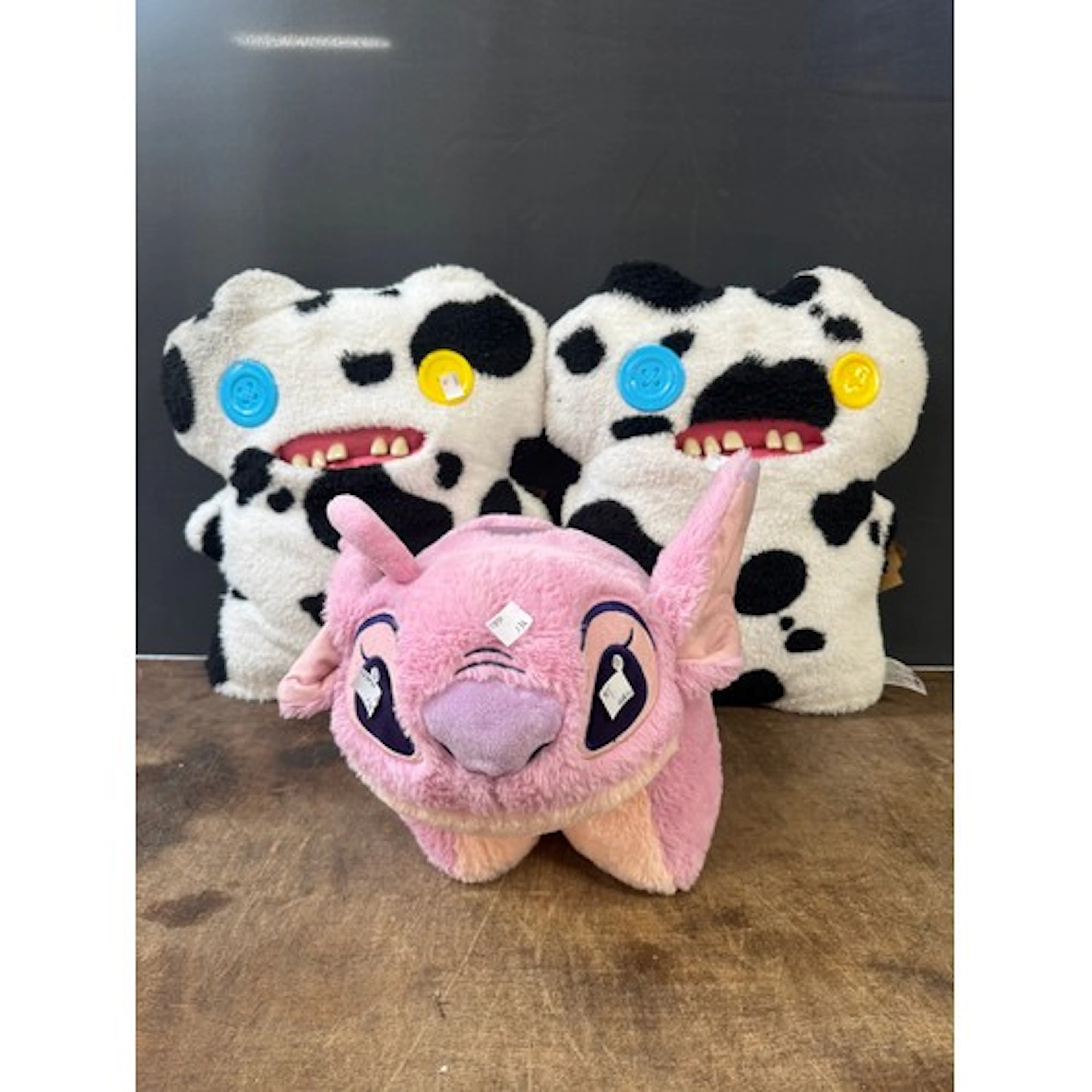 Two Fuggler soft toys and a Disney Play Pal character pillow...
