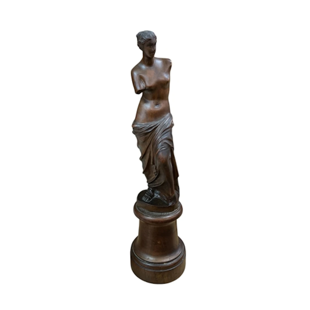 A early 20th century carved walnut figure of the Venus de Mi...