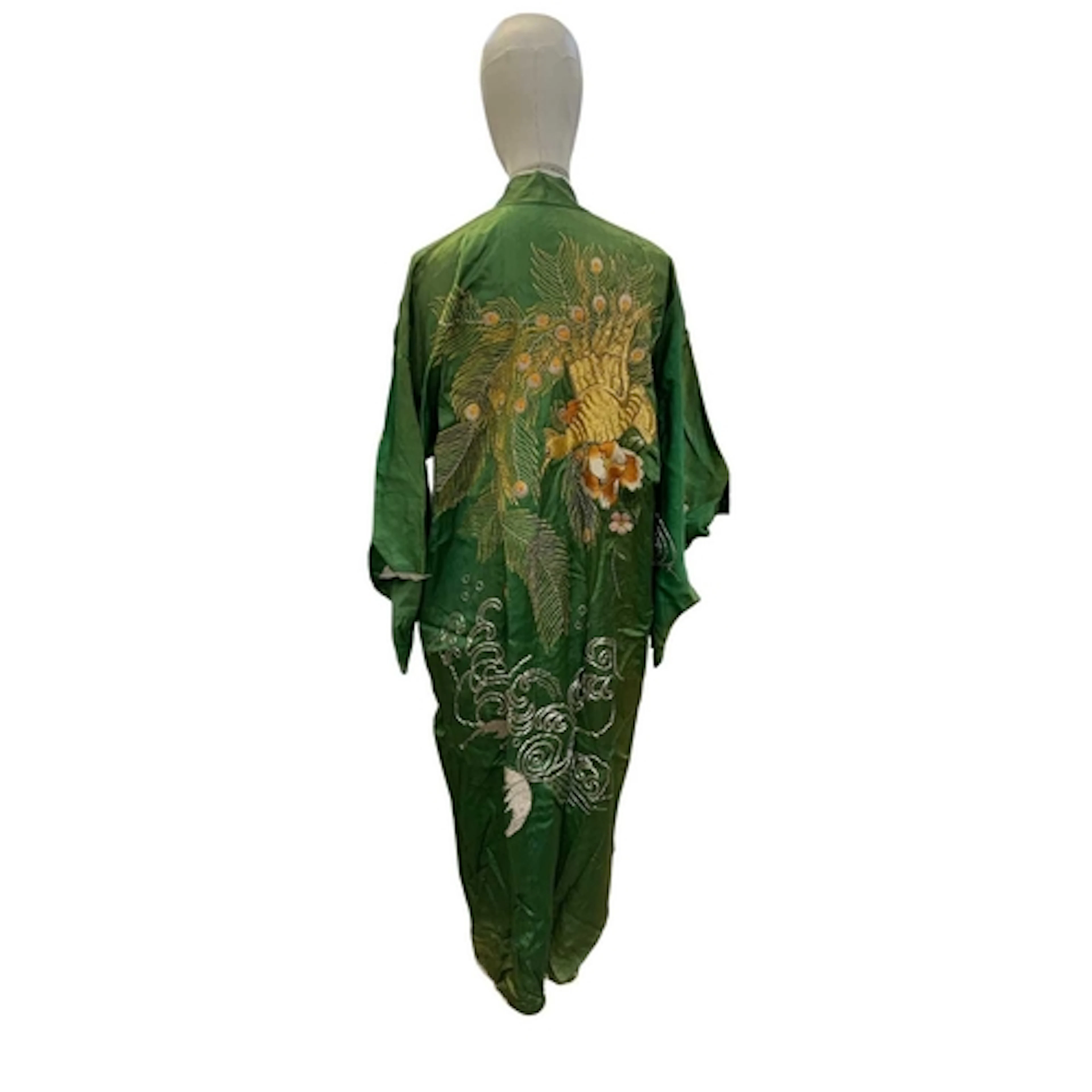 An embroidered Japanese kimono. 20th century, in bright emer...