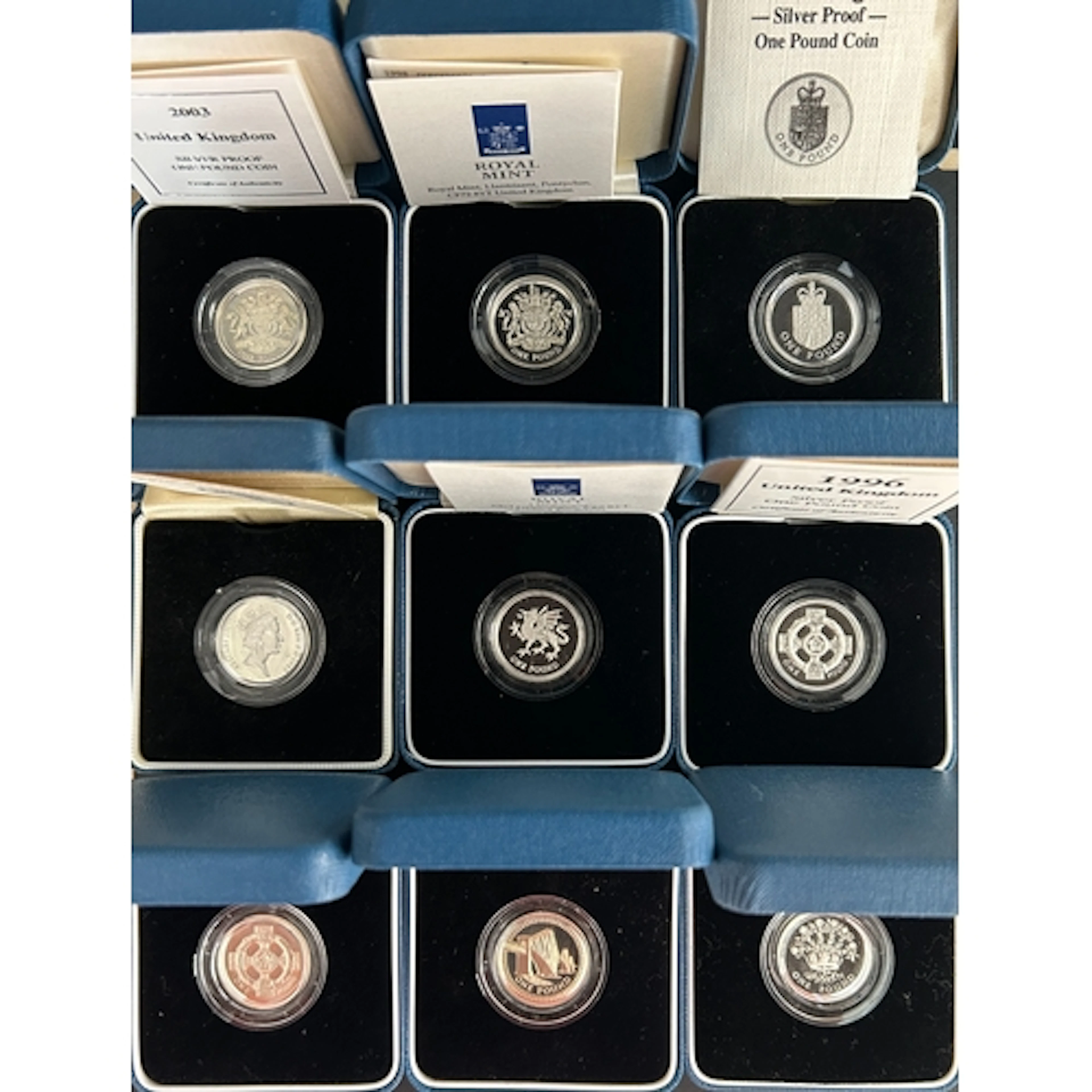 A duplicated collection of fifteen UK QEII silver proof £1 c...