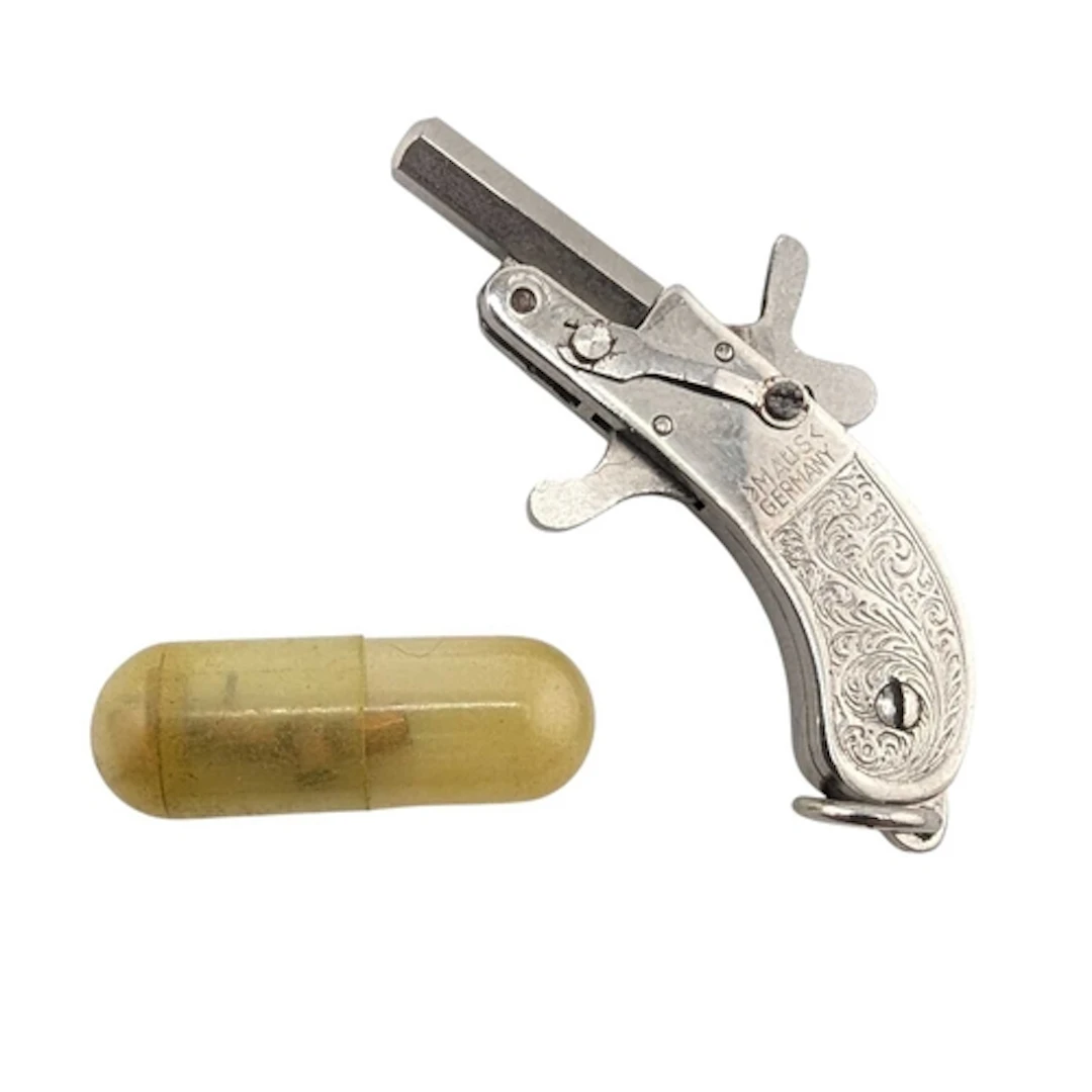 A vintage circa 1930s German Maus made miniature rimfire toy...