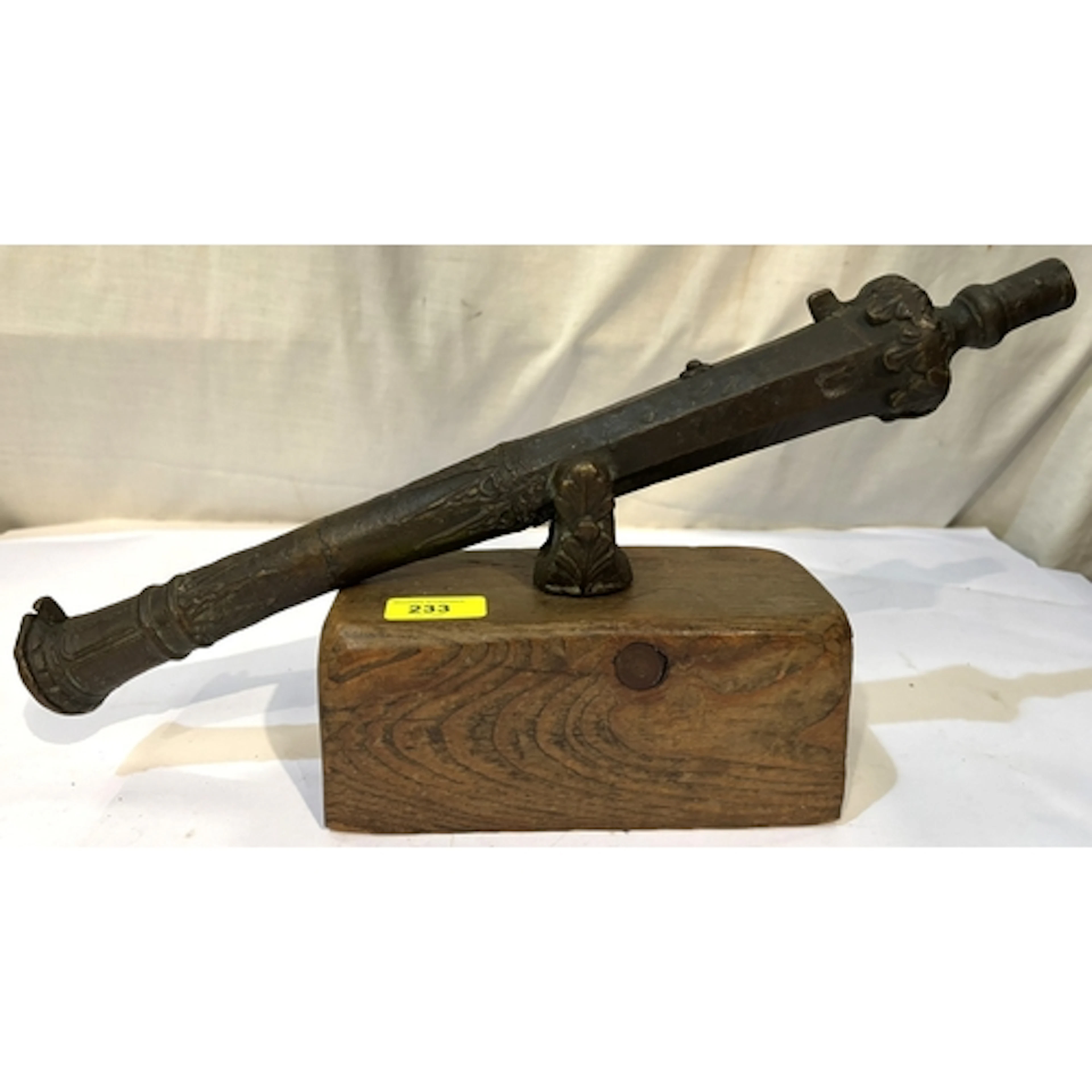 An antique bronze Indonesian Lantaka cannon on wooden block ...
