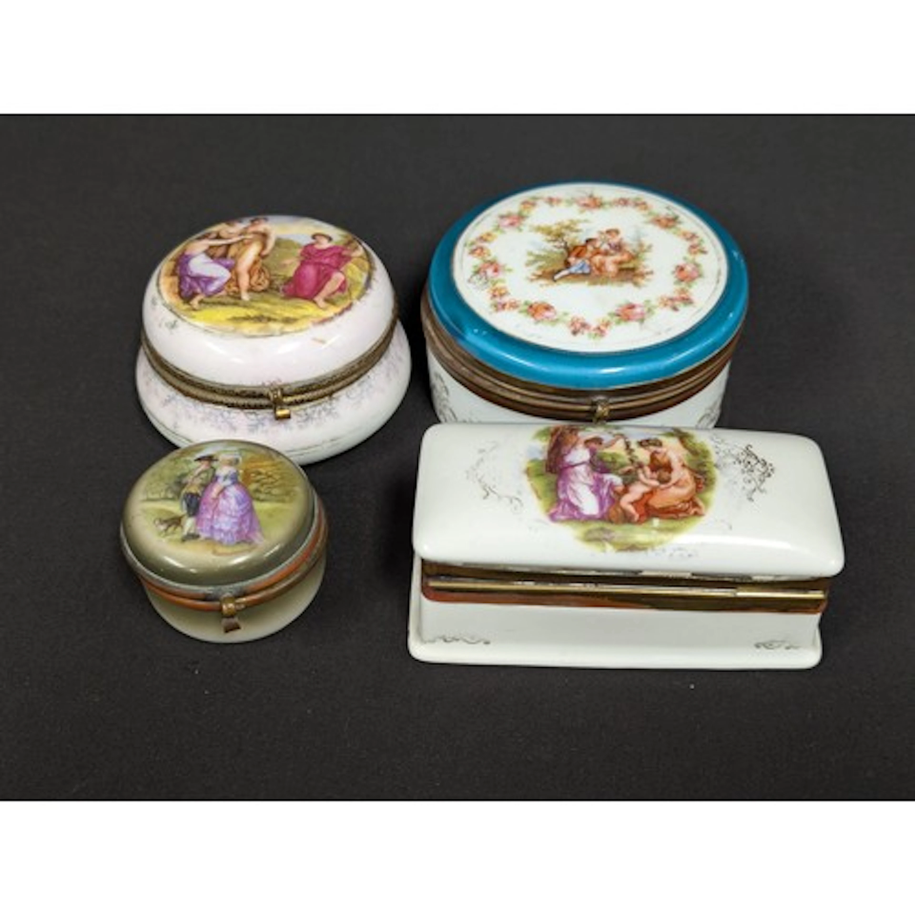 Three circular porcelain trinket box’s, two decorated with f...