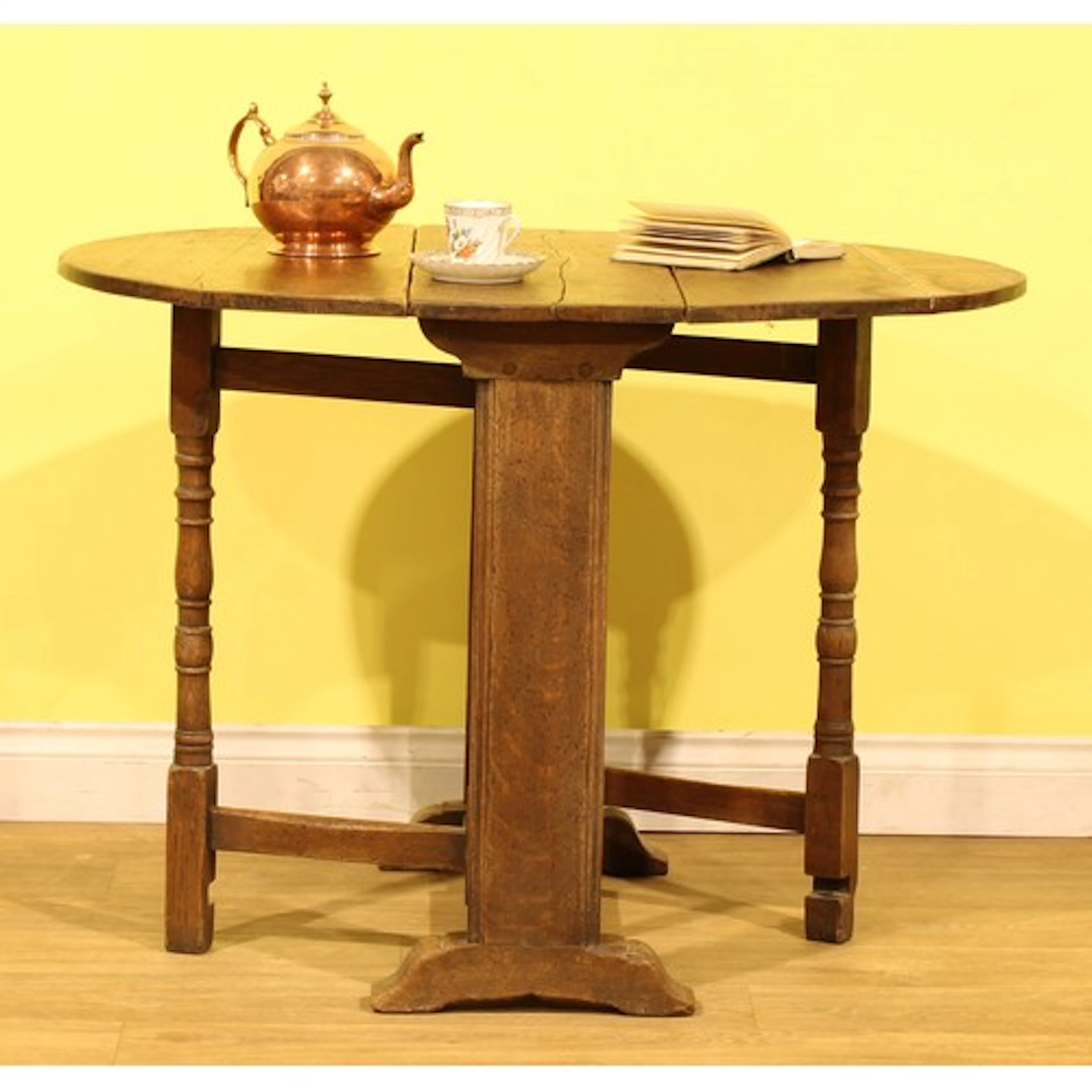 An early 18th century oak gateleg table, oval top with fall ...